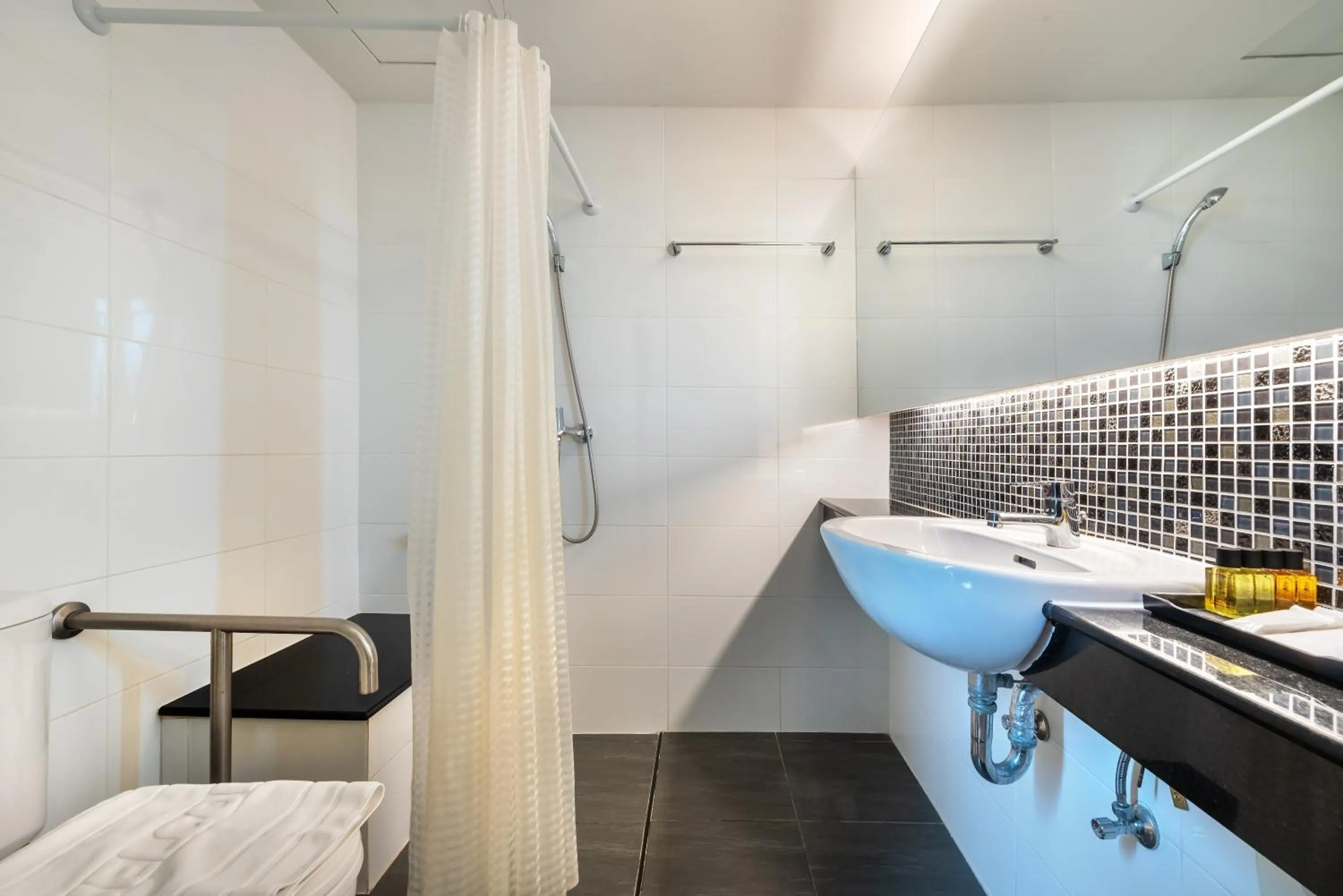 Bathroom in The Legacy Convention Hotel