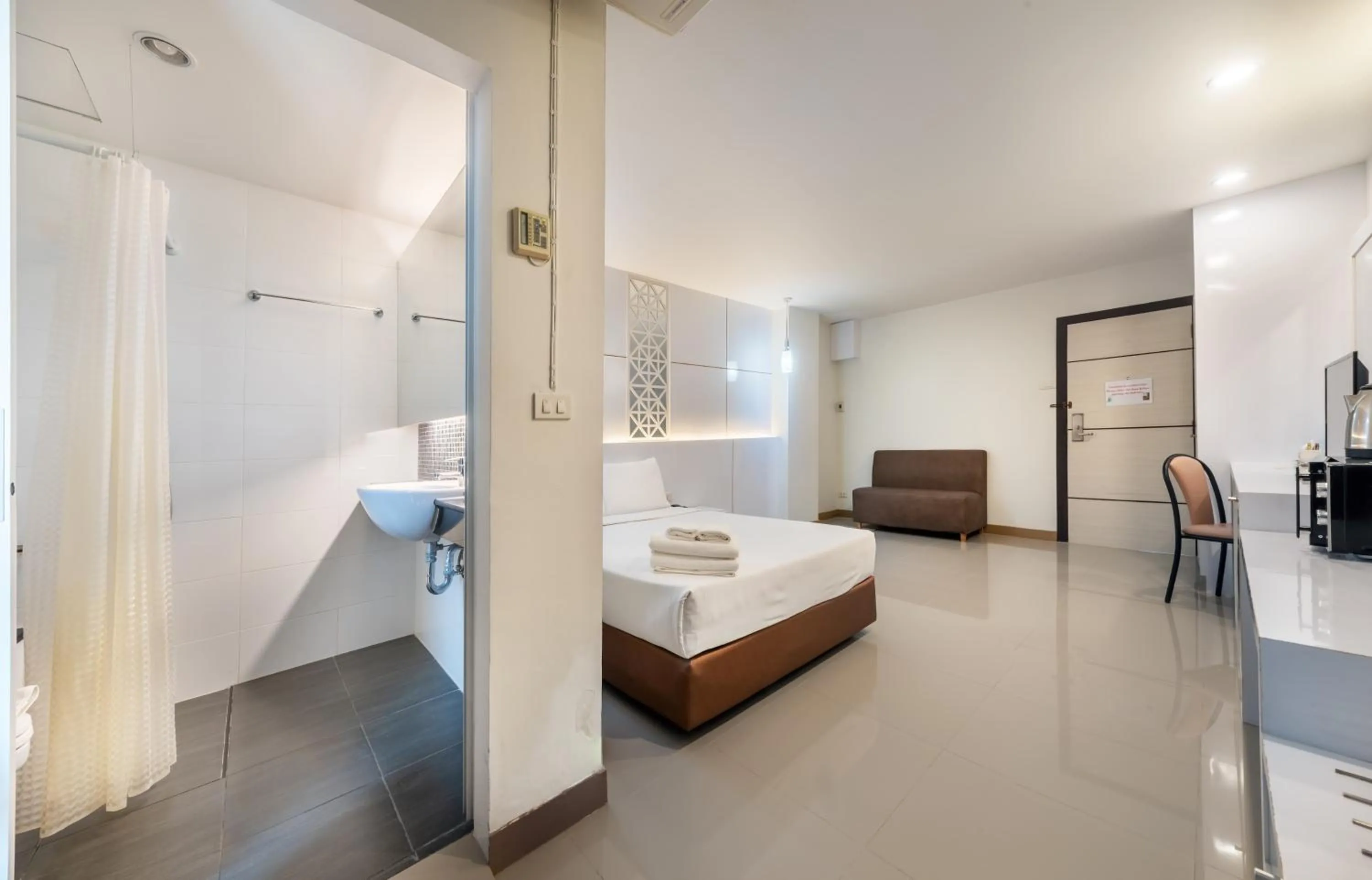 Bed in The Legacy Convention Hotel