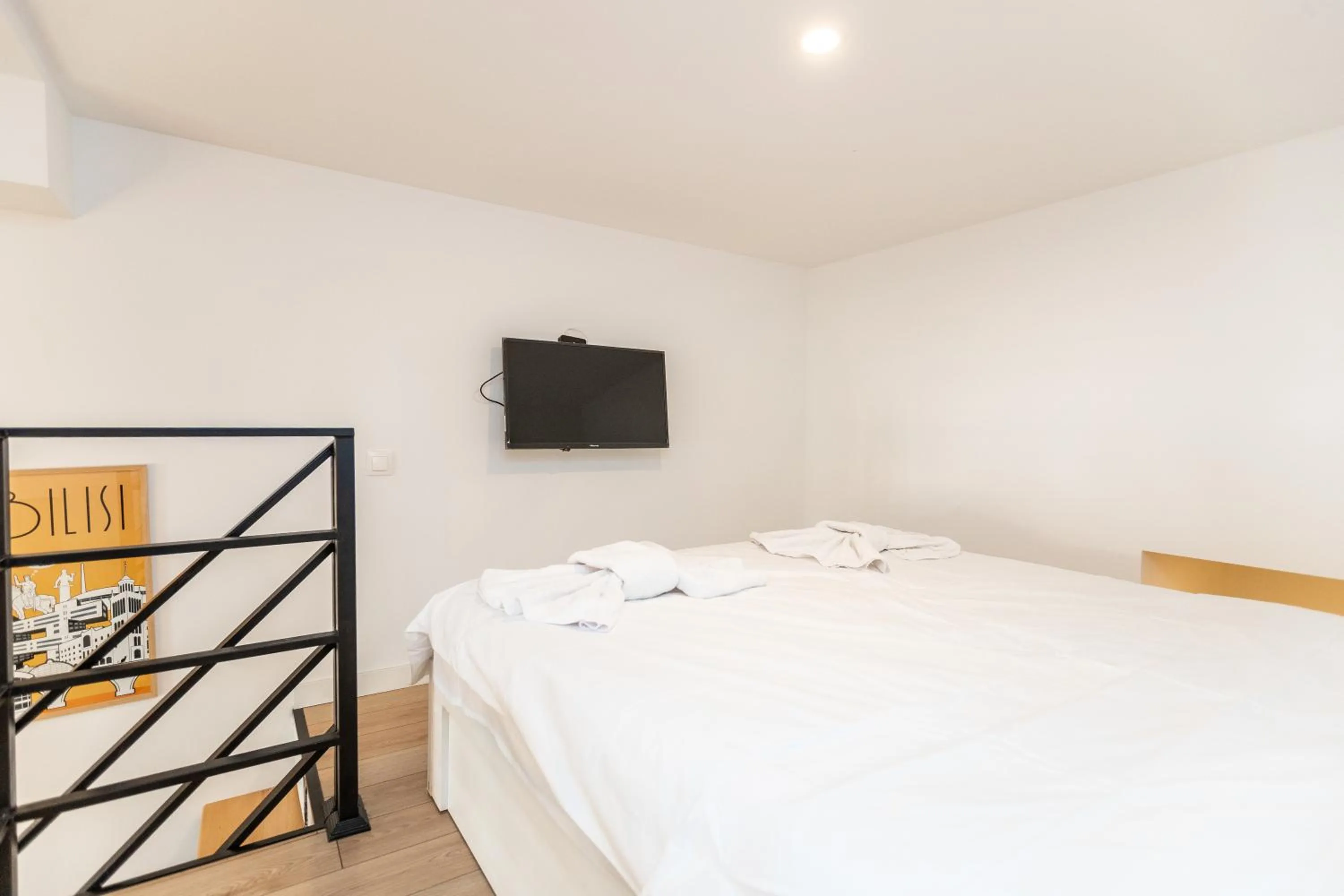 Communal lounge/ TV room, Bed in Shota Rustaveli Aparthotel