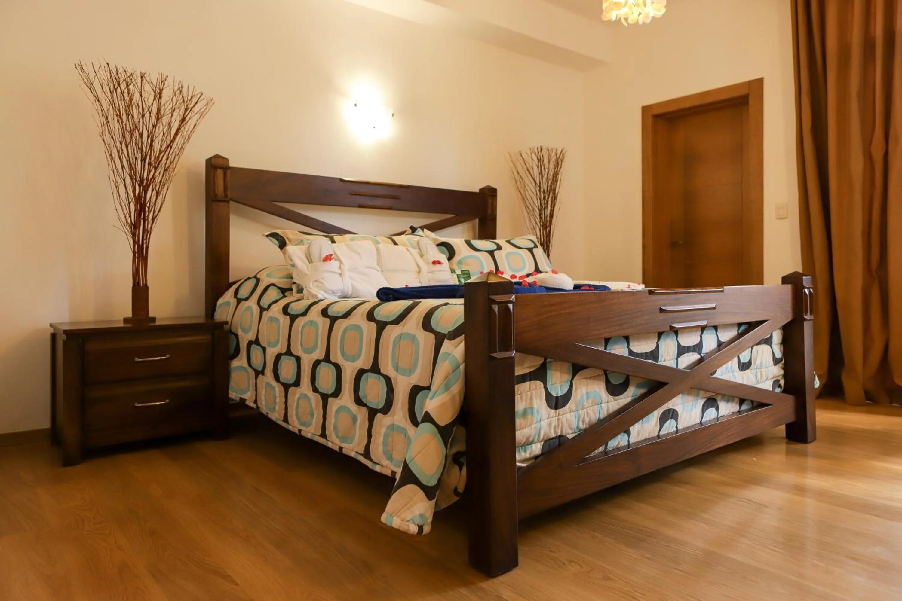 Bed in Sybaris Suites & Residences