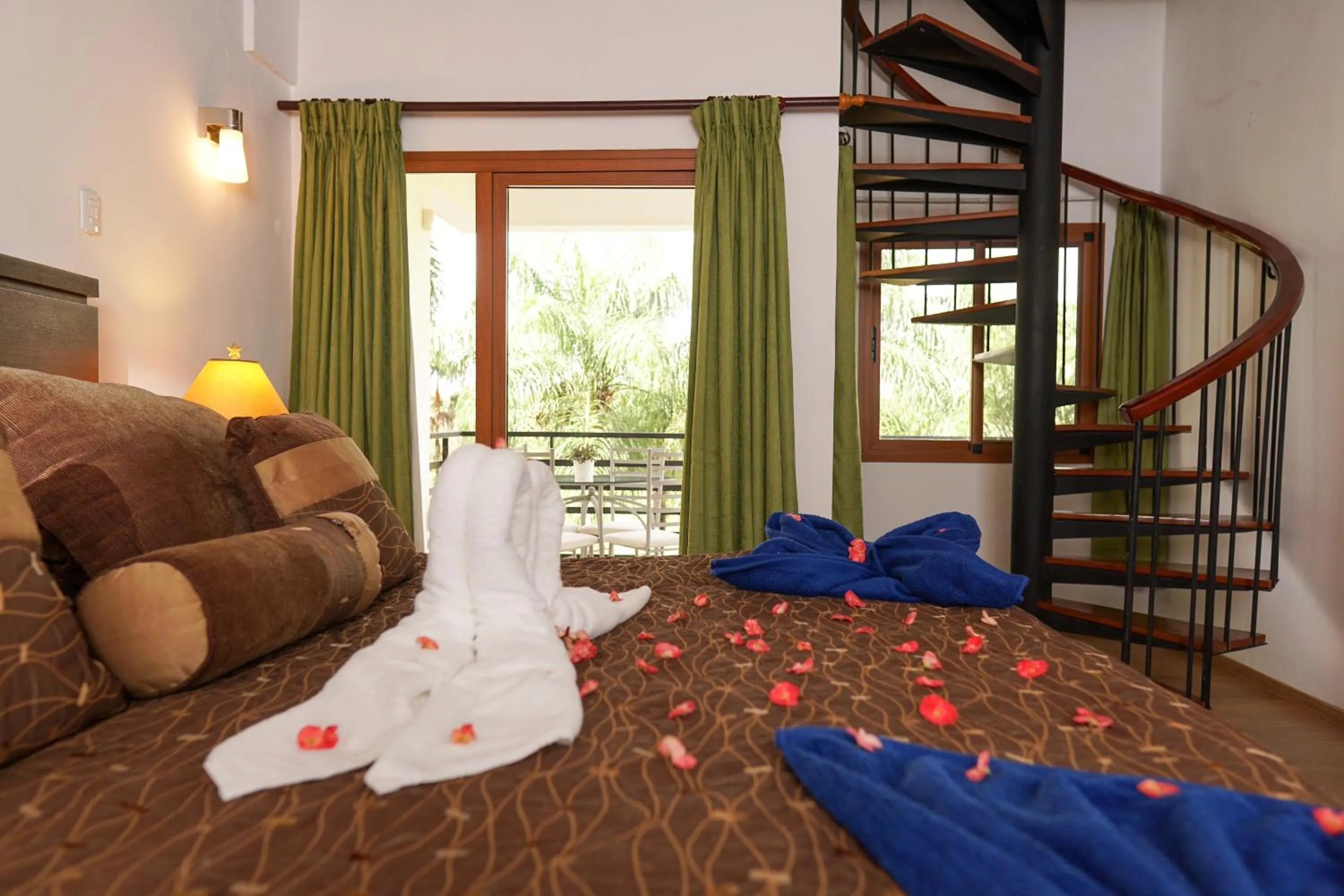 Bed in Sybaris Suites & Residences