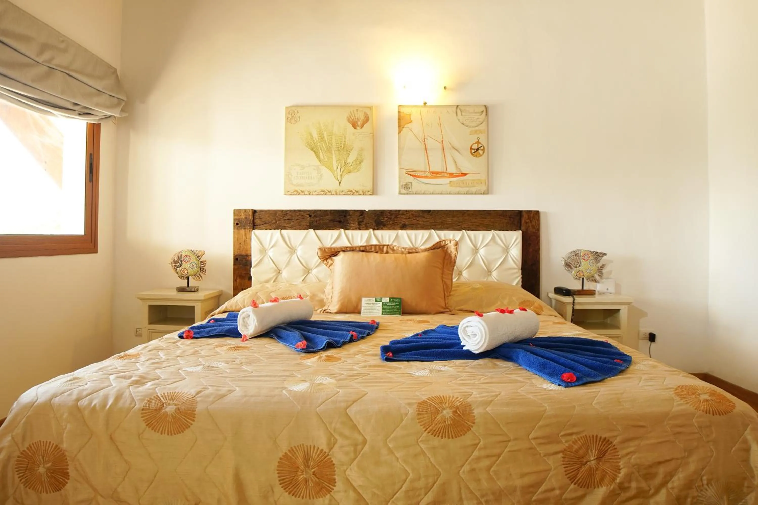 Bed in Sybaris Suites & Residences