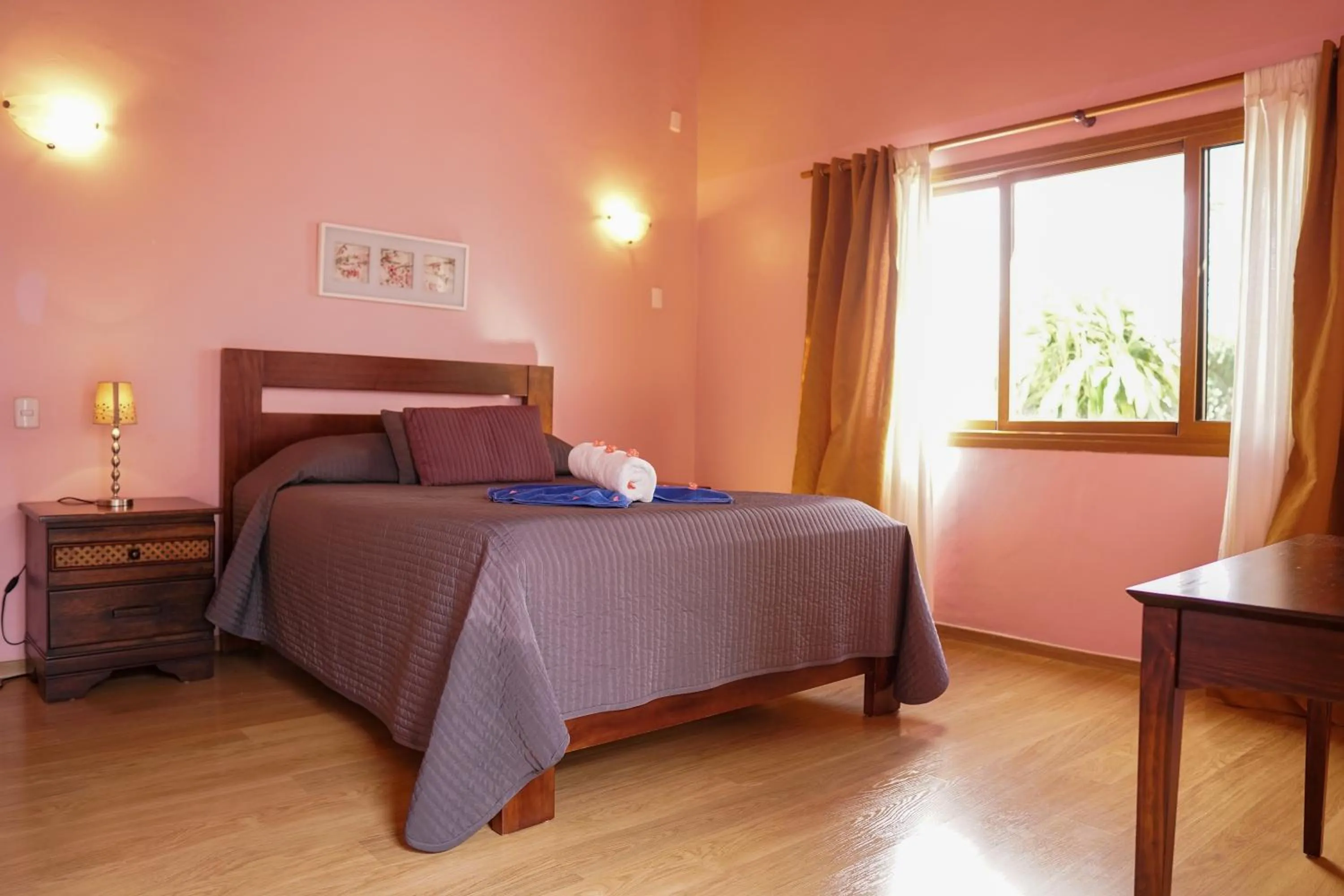 Bed in Sybaris Suites & Residences