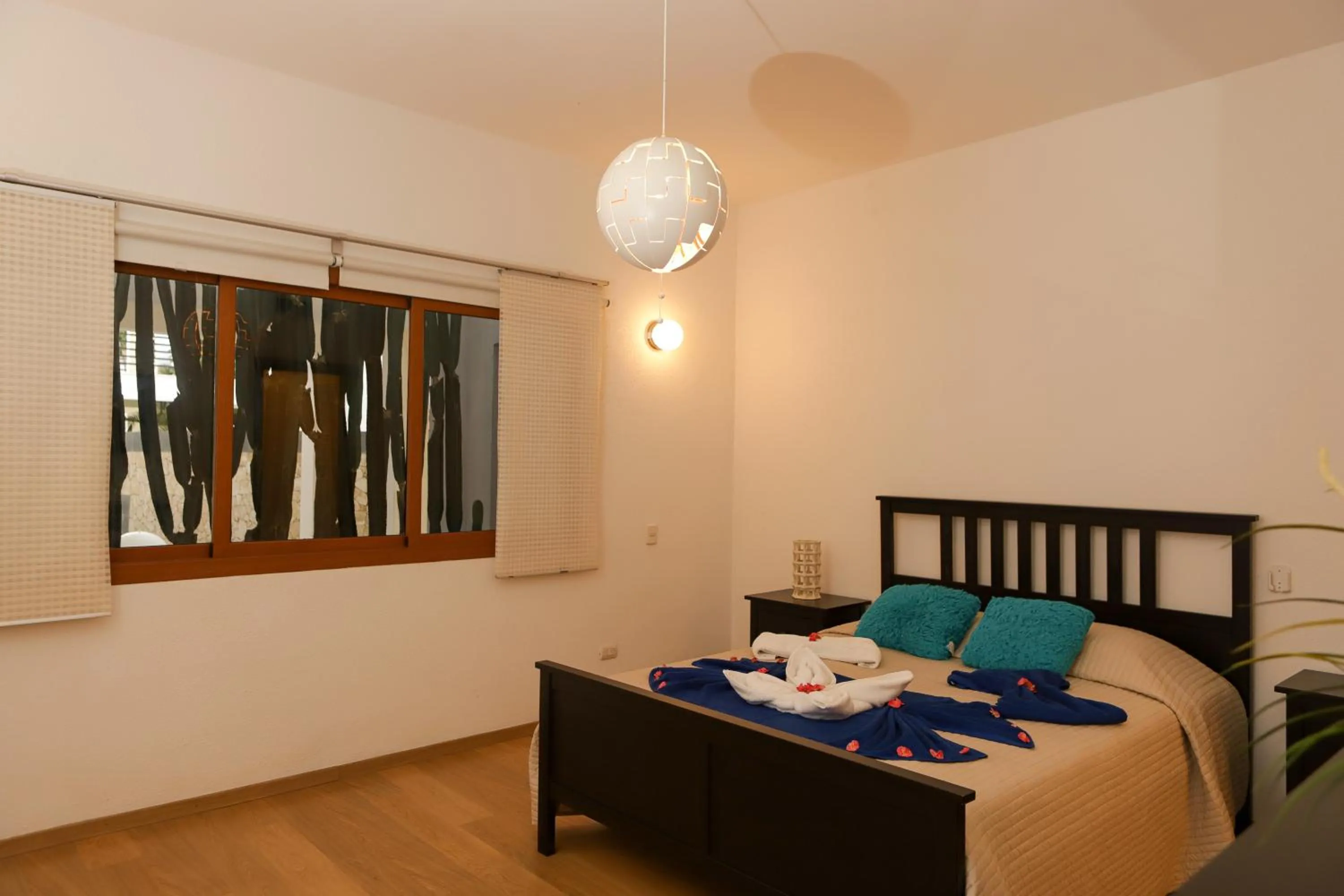 Bed in Sybaris Suites & Residences