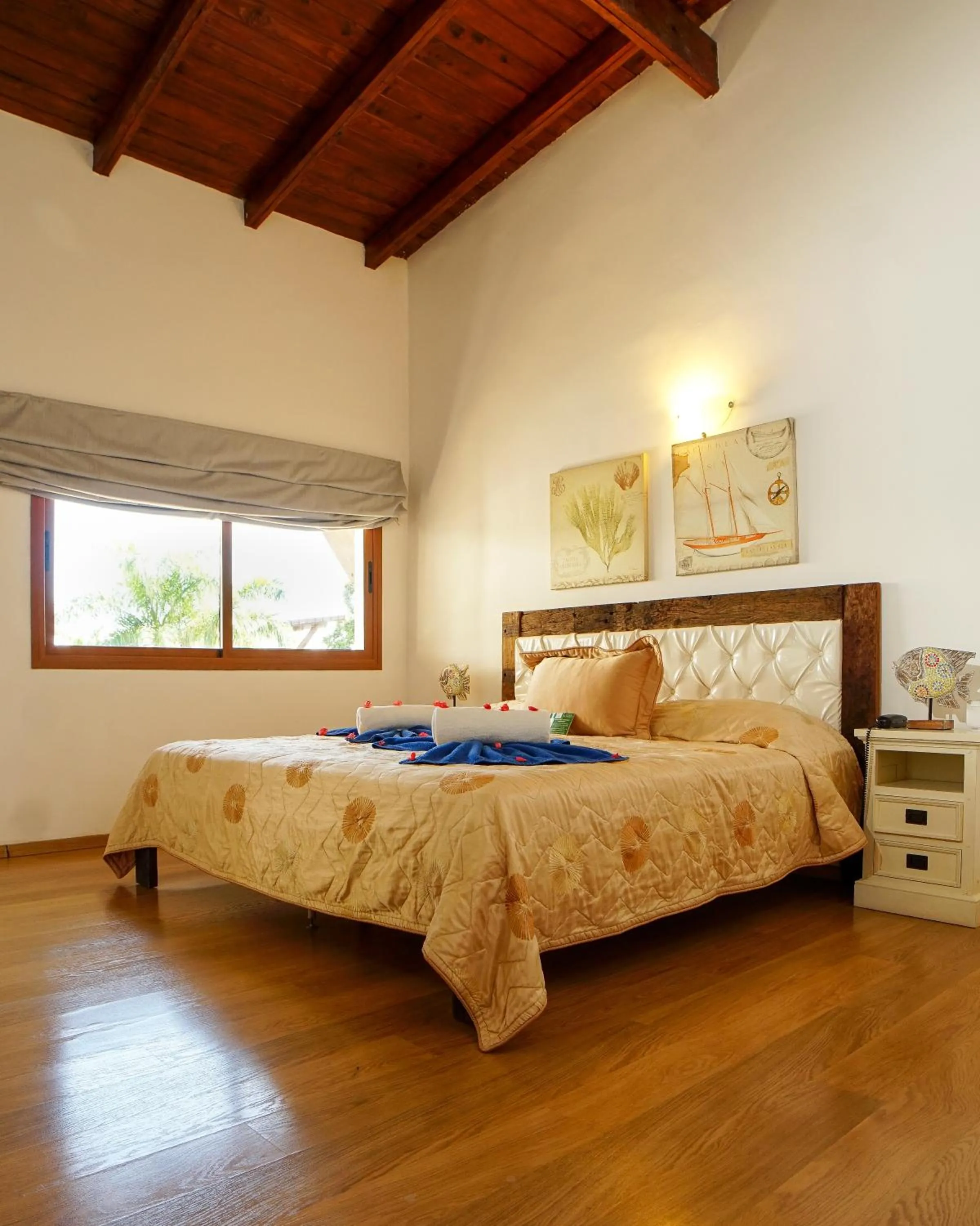 Bed in Sybaris Suites & Residences