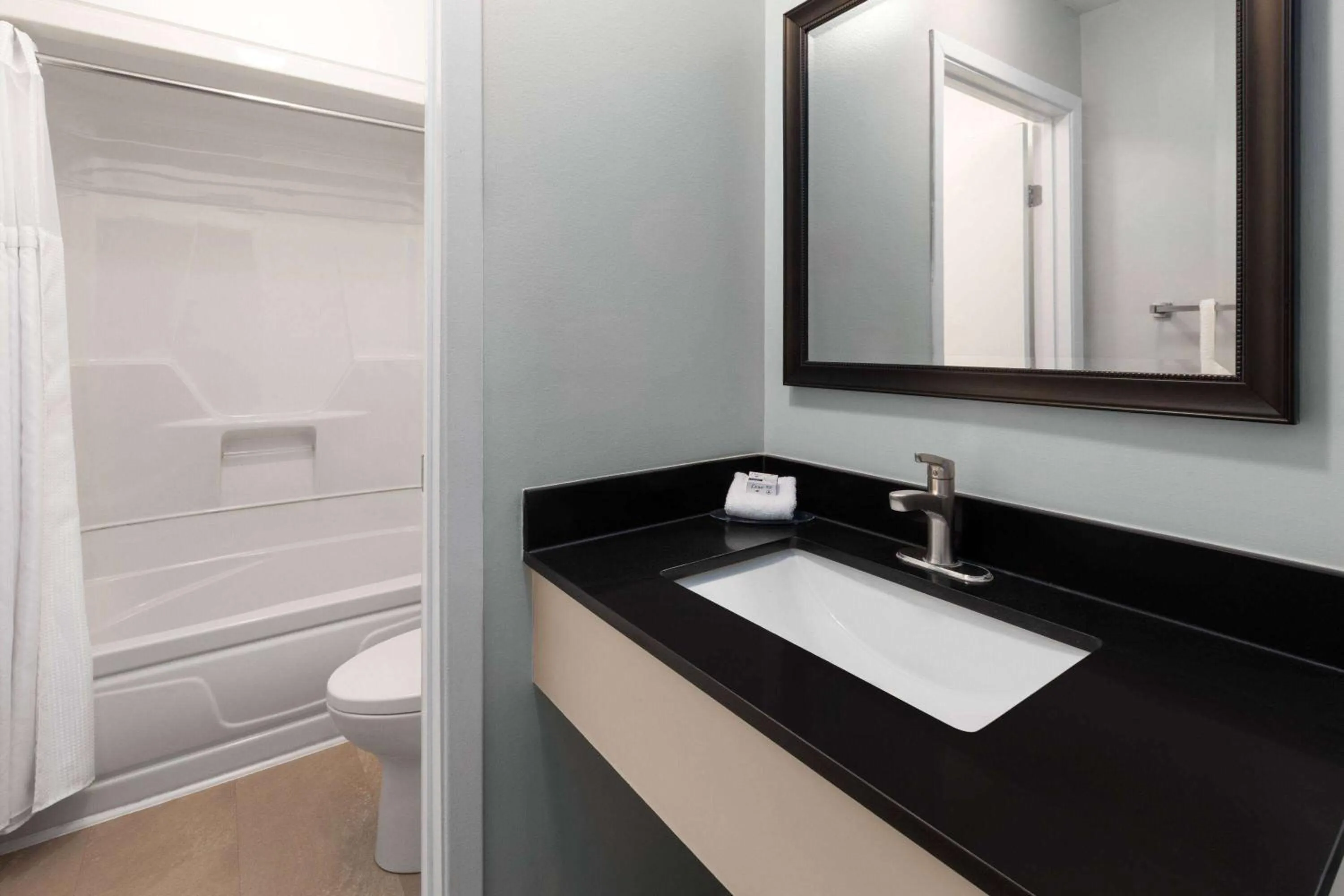 Bathroom in Travelodge by Wyndham Cochrane Ontario