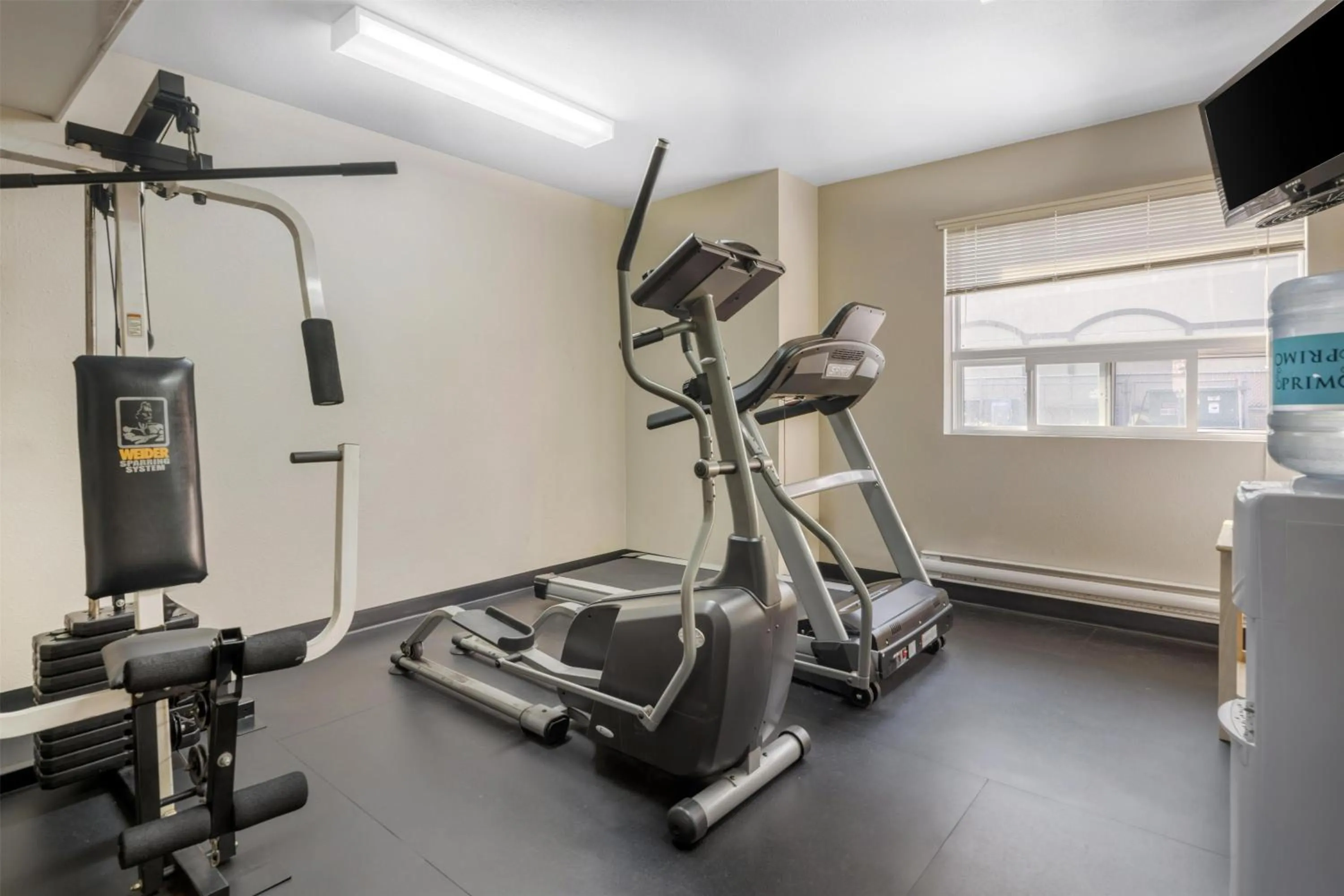 Fitness centre/facilities in SureStay Plus Hotel by Best Western Lethbridge
