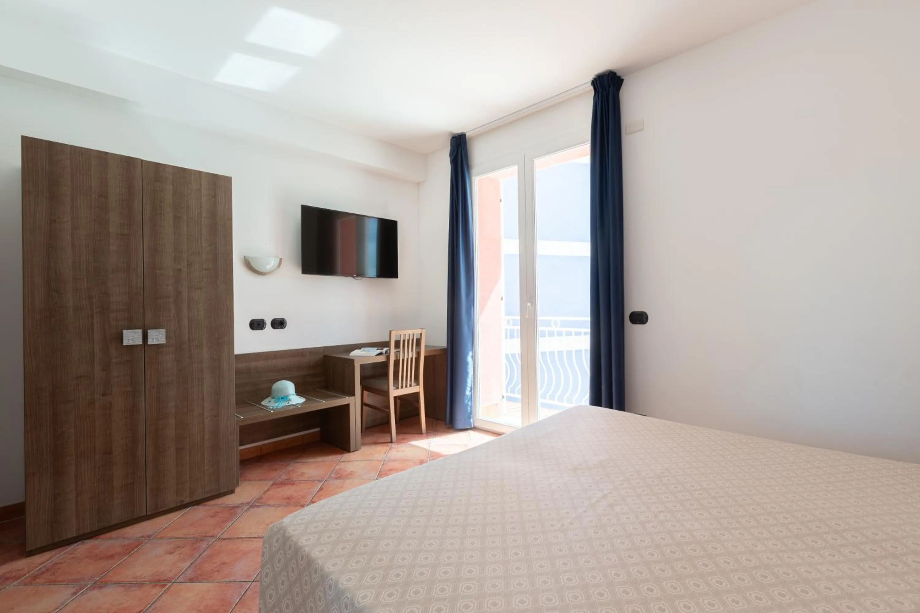 Bed in Ai Pozzi Village Resort & SPA