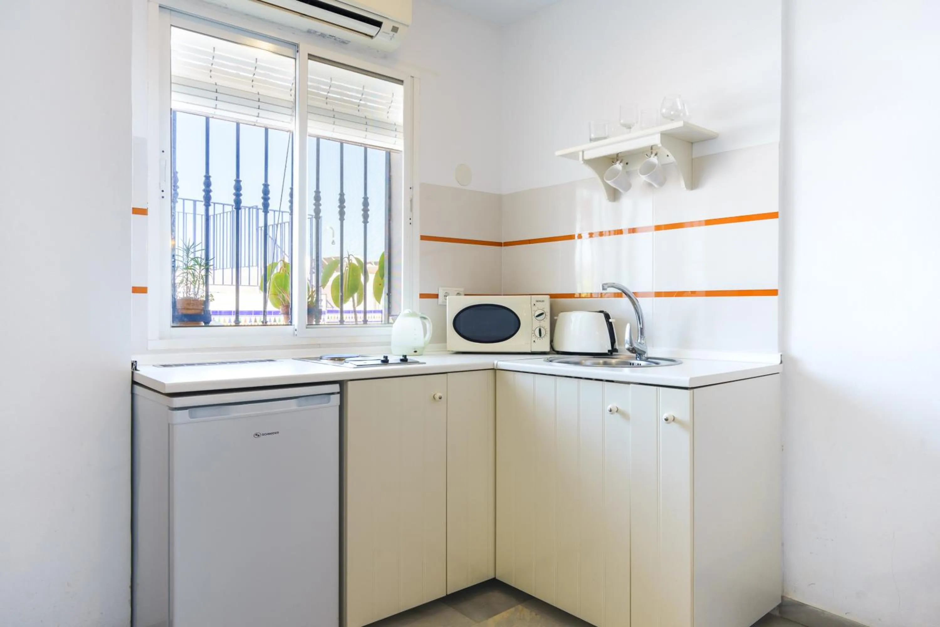 Kitchen or kitchenette in Apartamentos Pepe Mesa