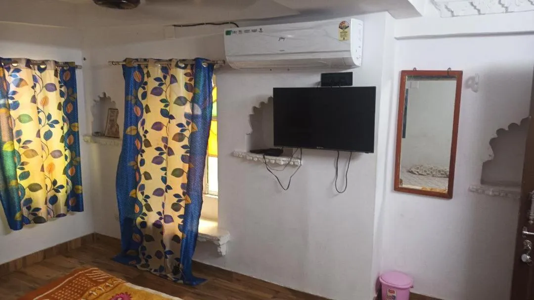 TV and multimedia in Jag Niwas Guest House & pure veg restaurant