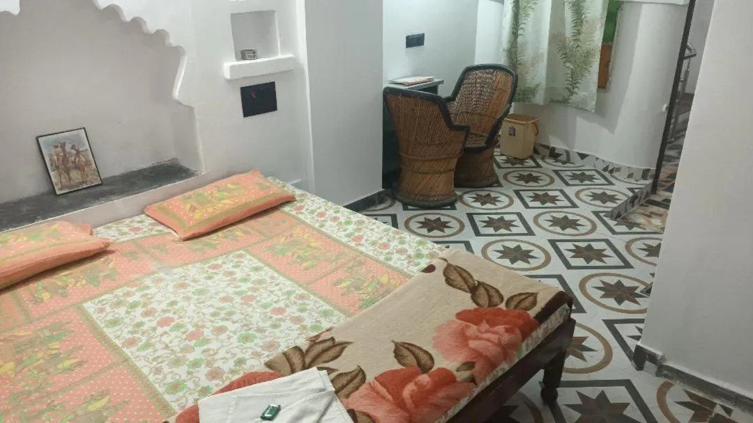 Photo of the whole room, Bed in Jag Niwas Guest House & pure veg restaurant