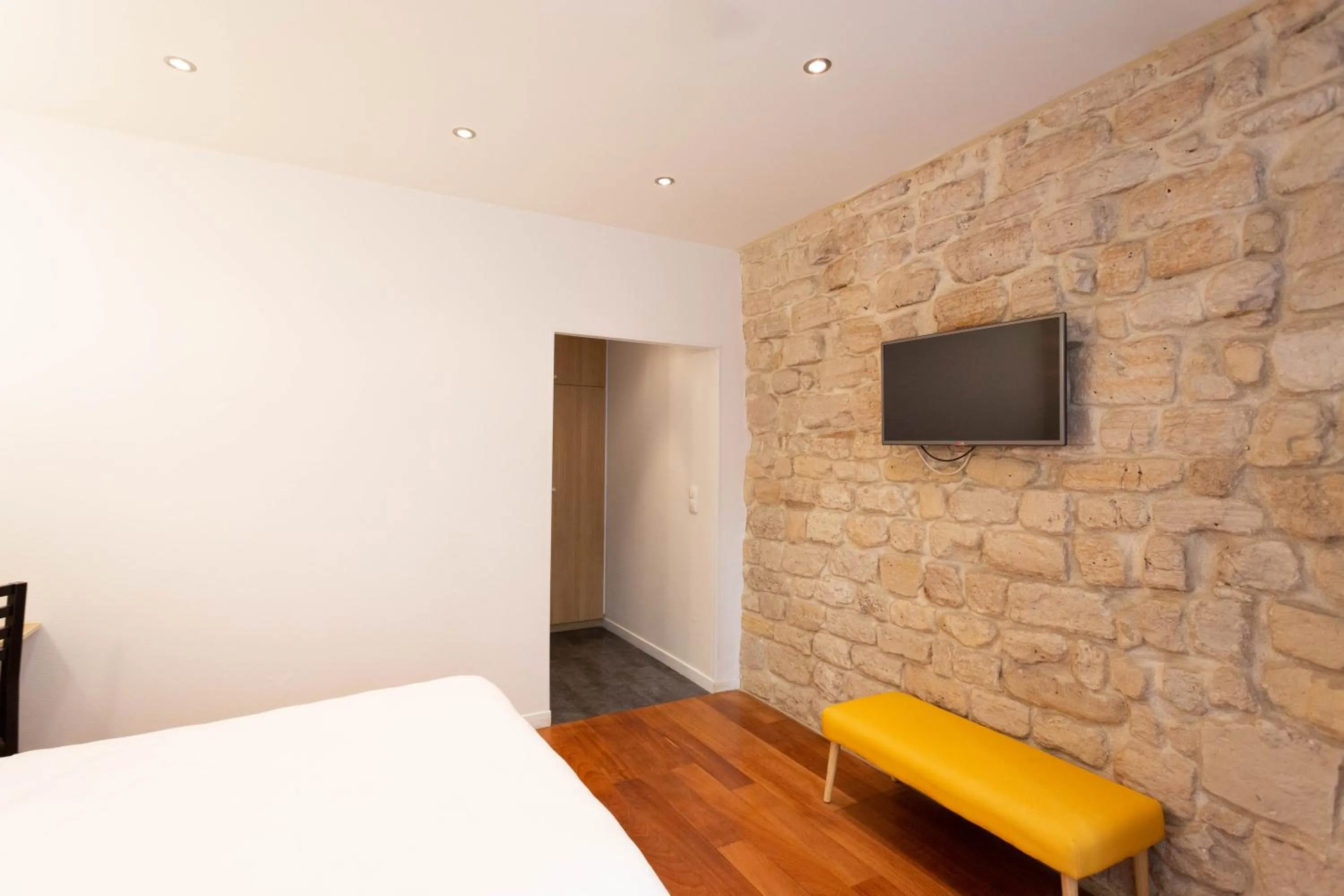 Seating area, Bed in Hotel Mimosa Paris