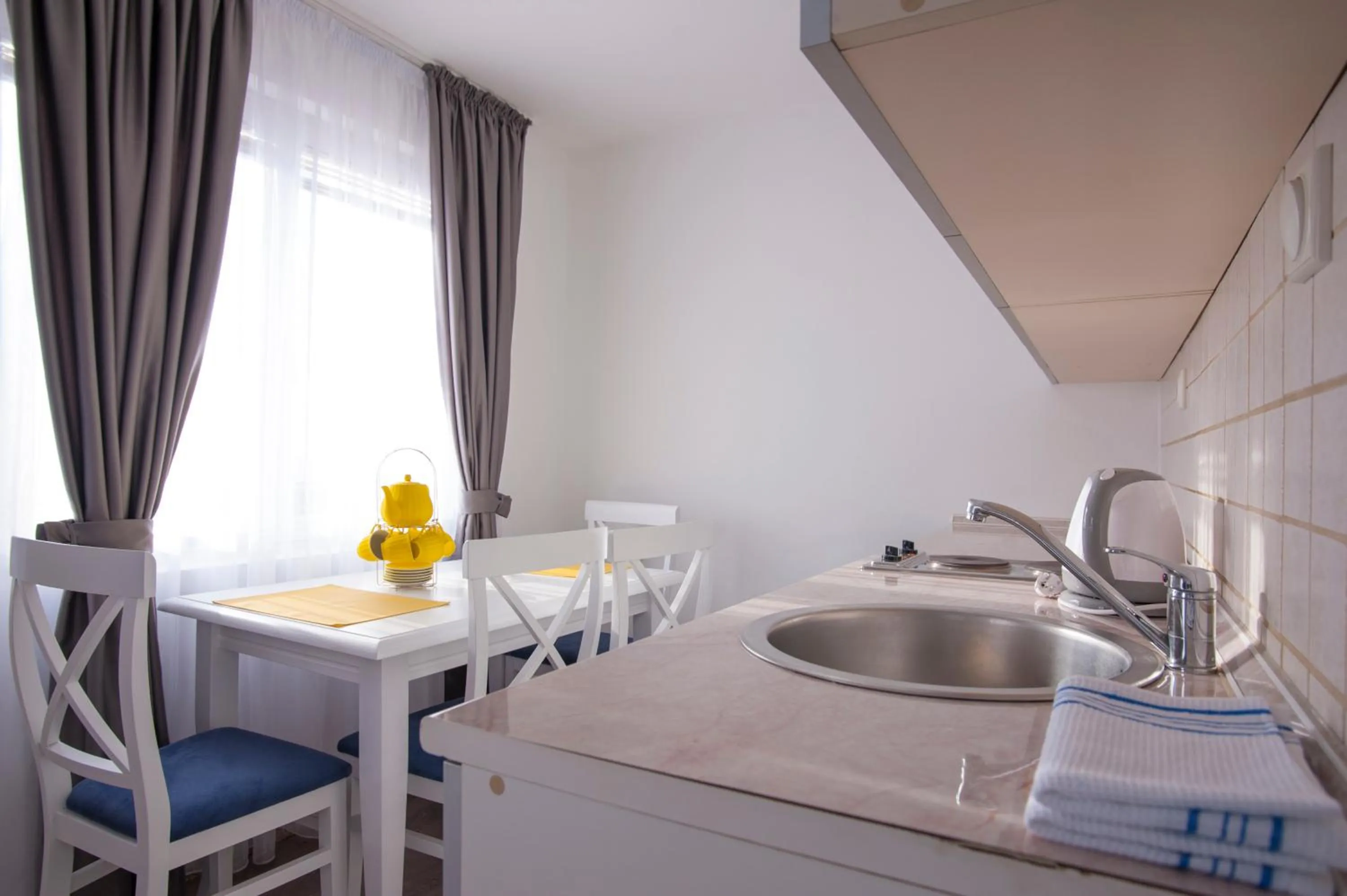 Kitchen or kitchenette in Apartments Grand