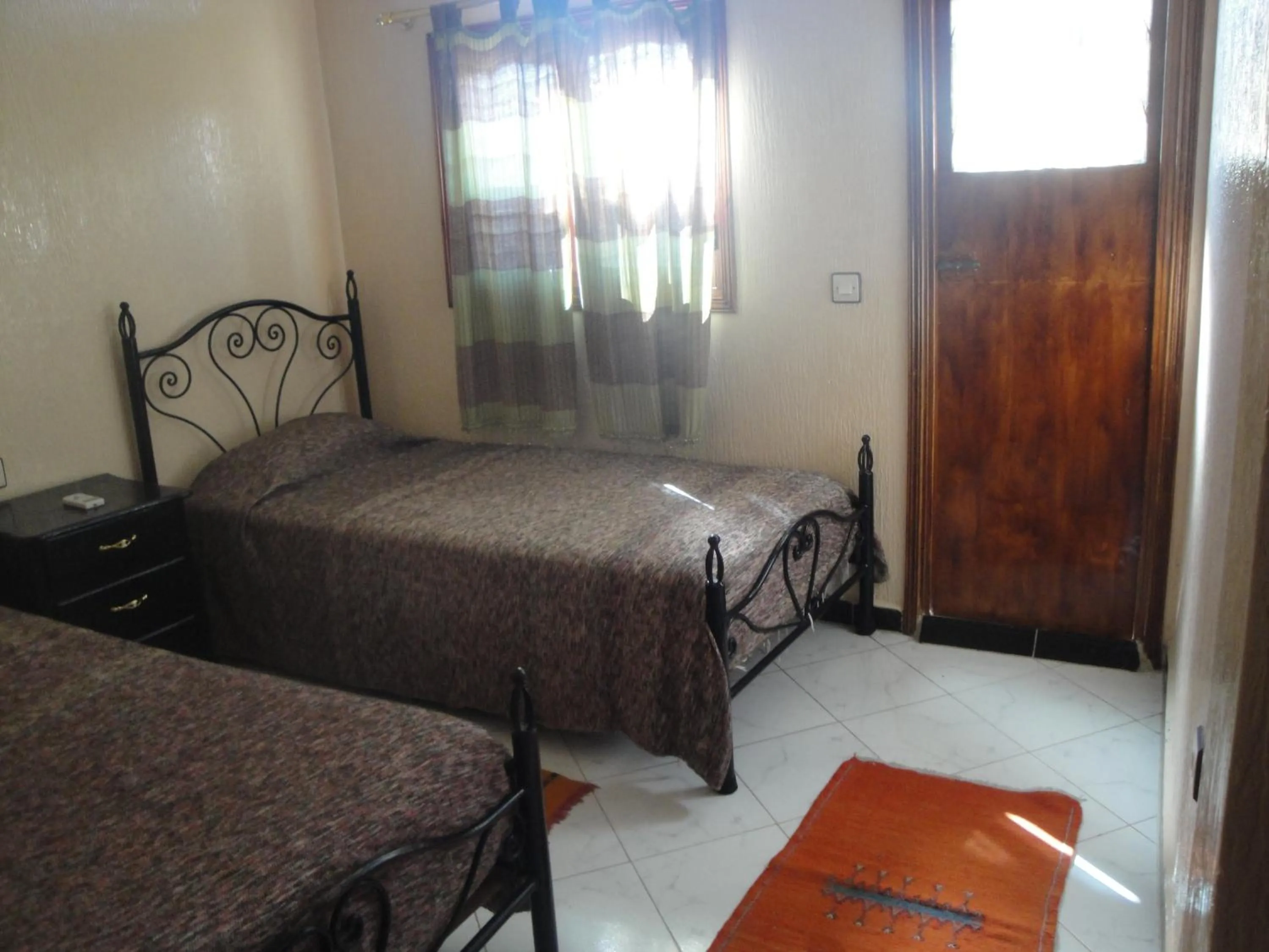 Photo of the whole room, Bed in Hôtel Tijani
