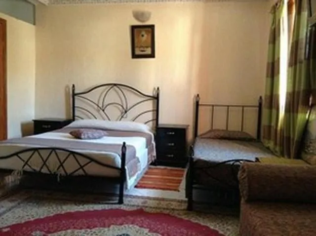 Photo of the whole room, Bed in Hôtel Tijani
