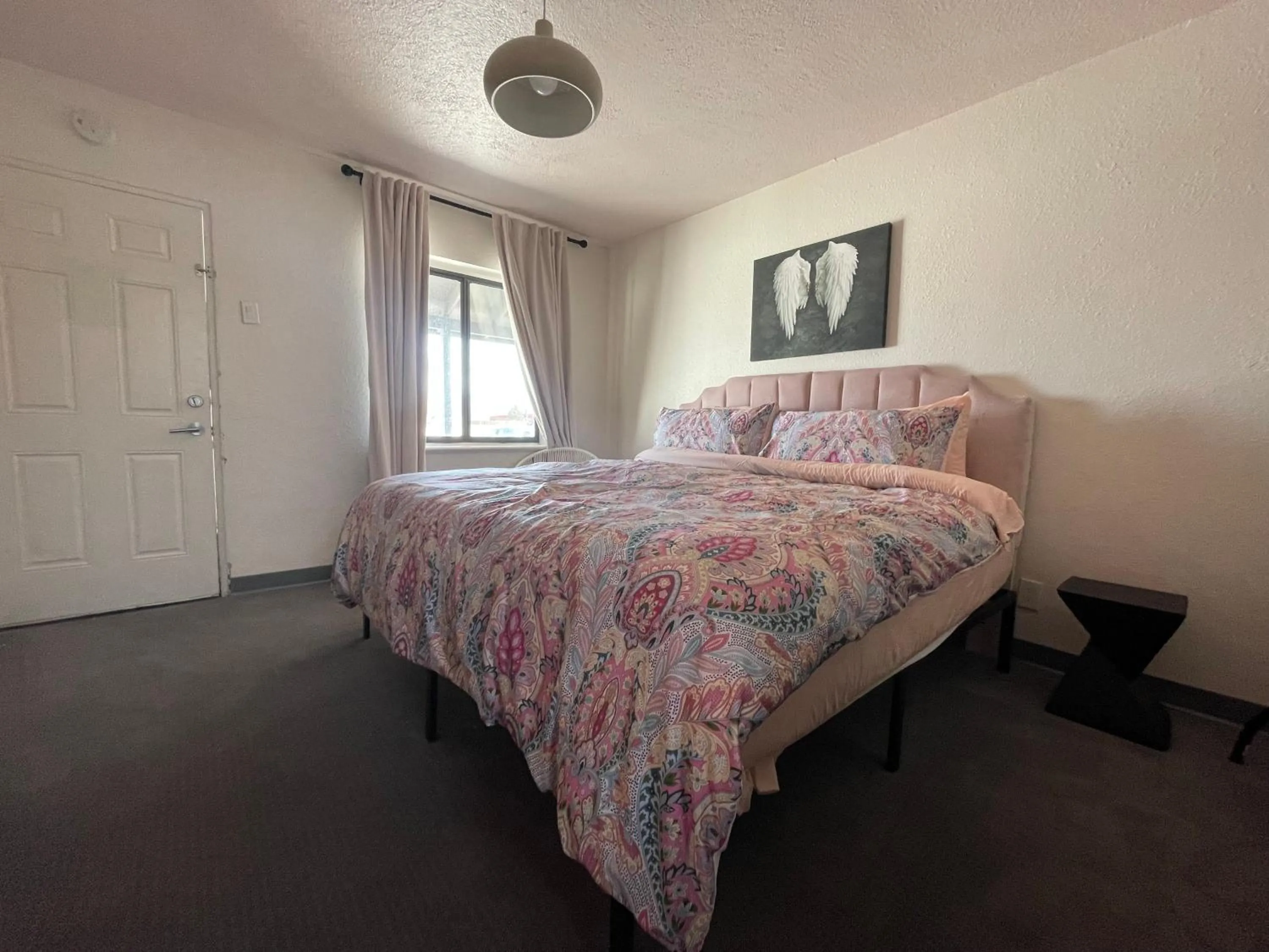 Bed in Rainbow Motel