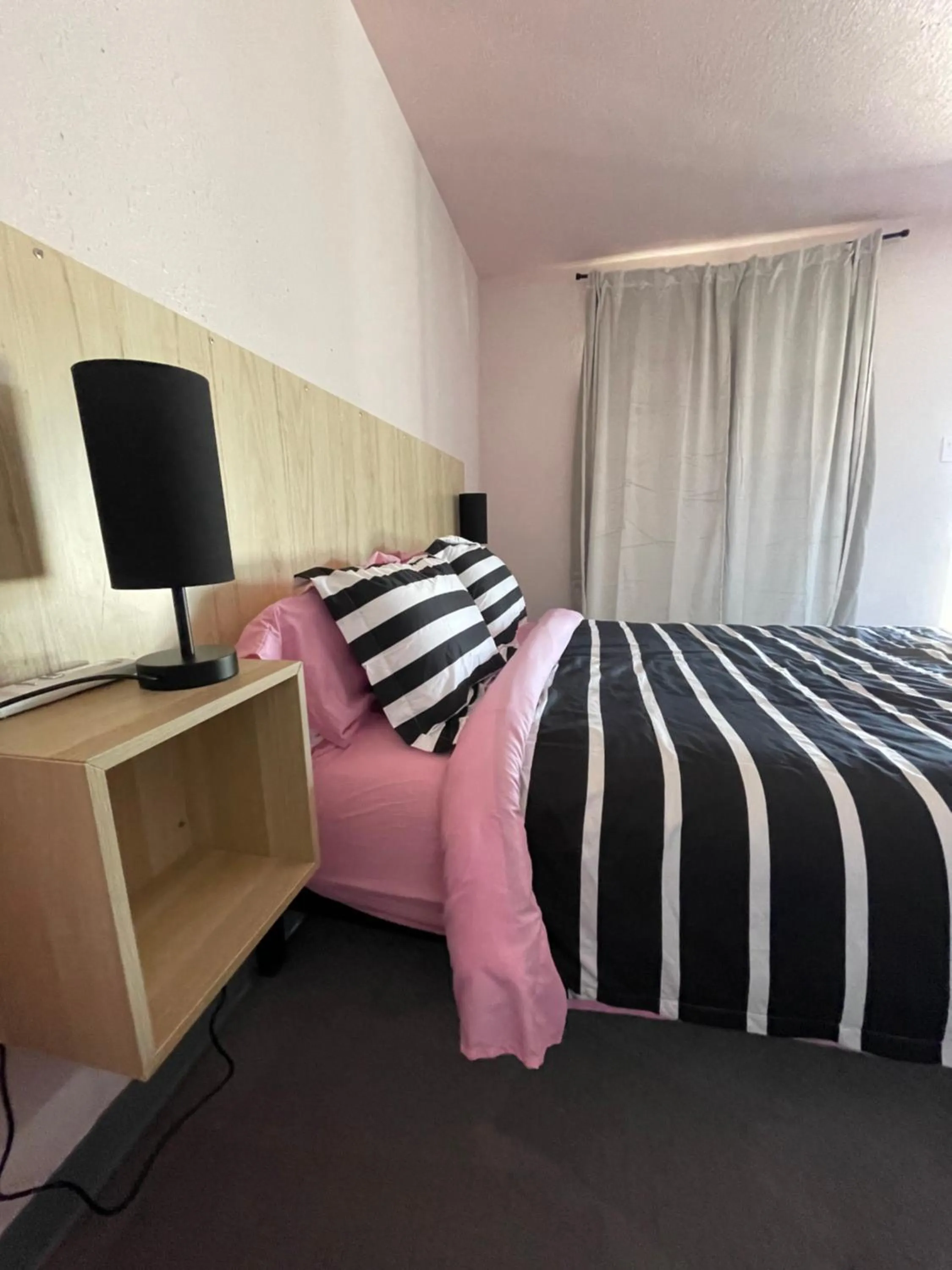 Bed in Rainbow Motel