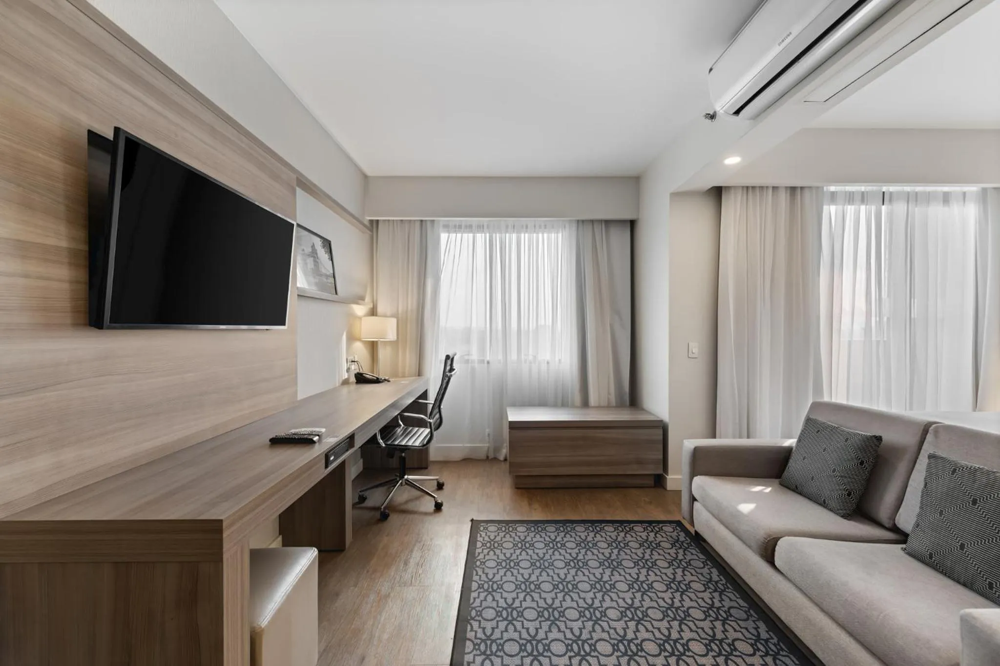 Seating area in Staybridge Suites São Paulo by IHG