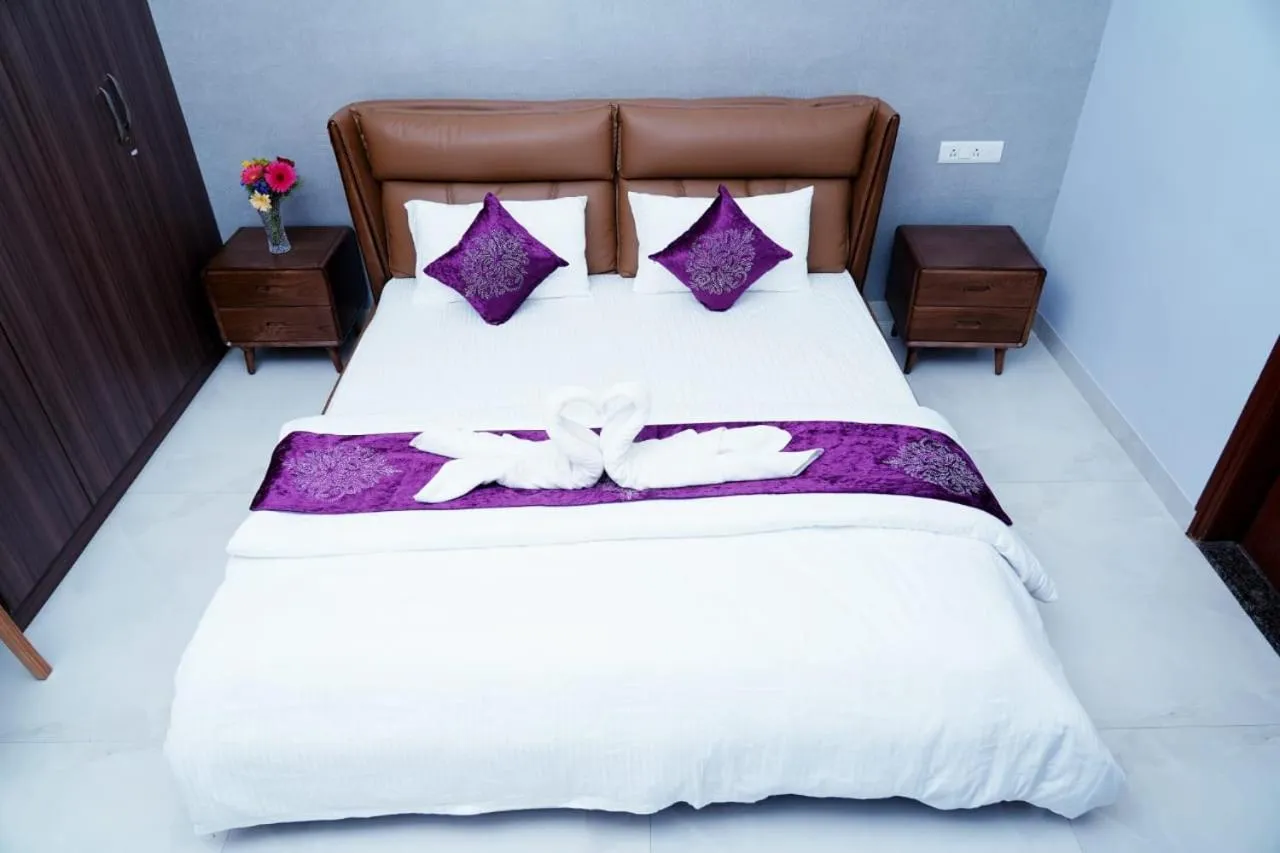 Bed in UNNATHI SUITES