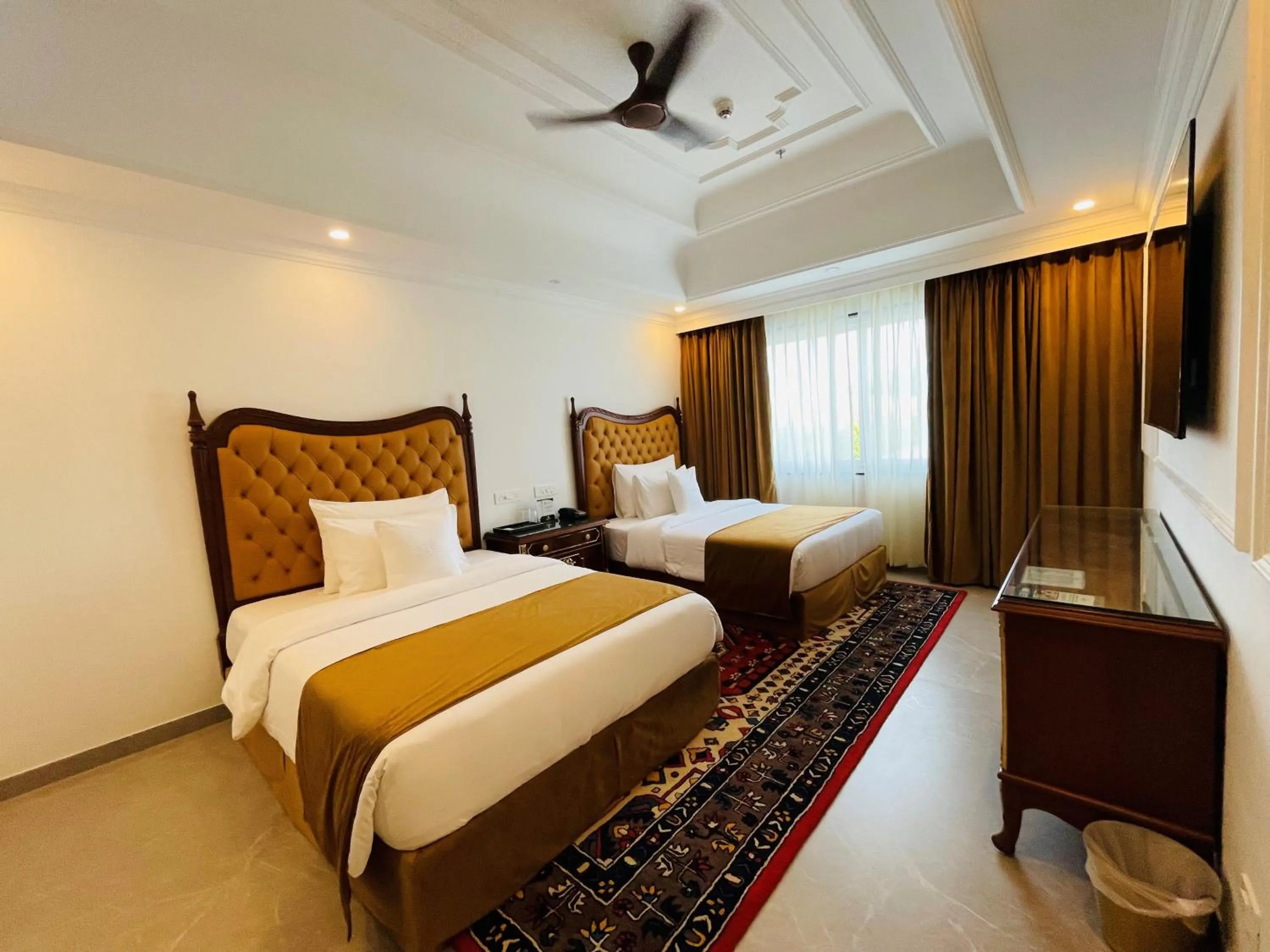 Bed in Mayfair Palm Beach Resort