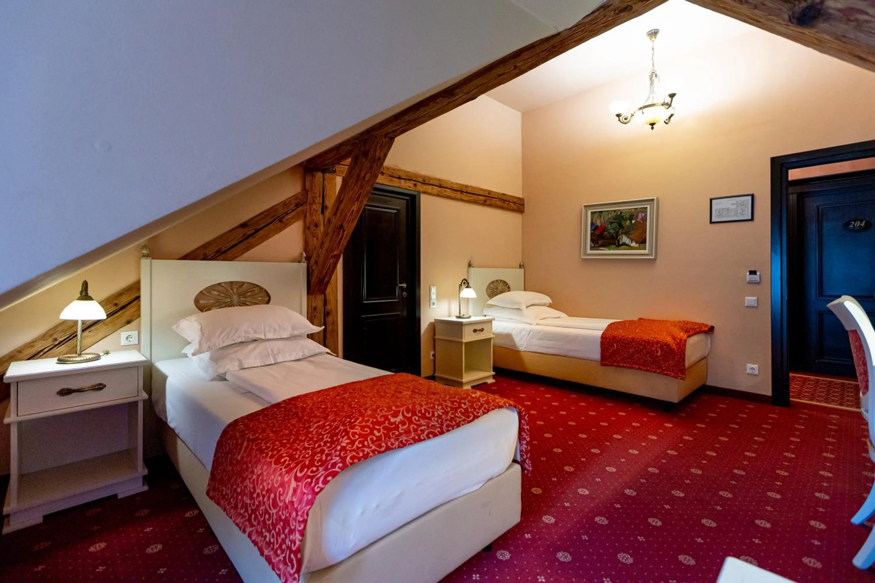 Bed in Hotel Central Park Sighisoara