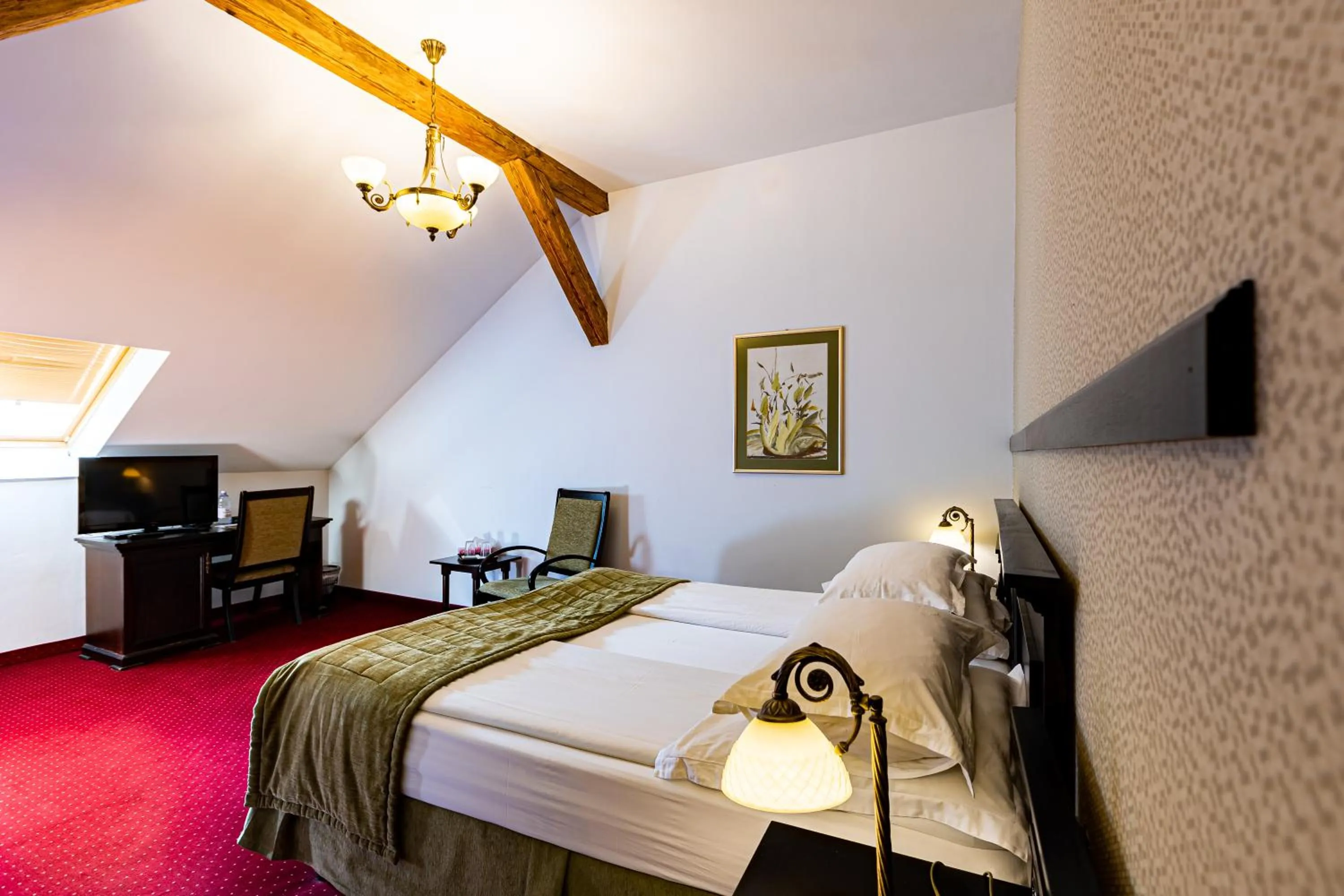 Bed in Hotel Central Park Sighisoara