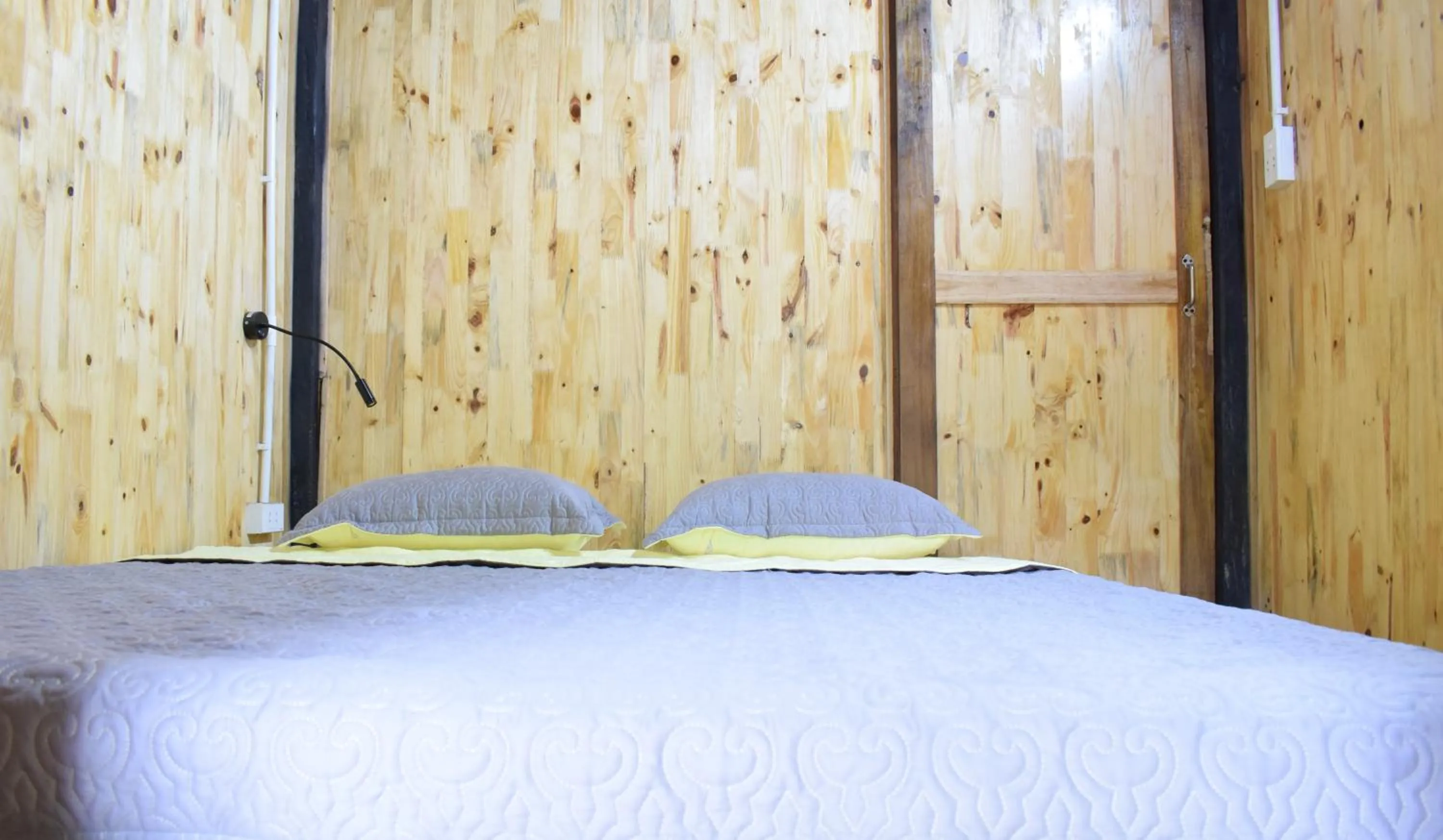 Bed in Golden Jungle House