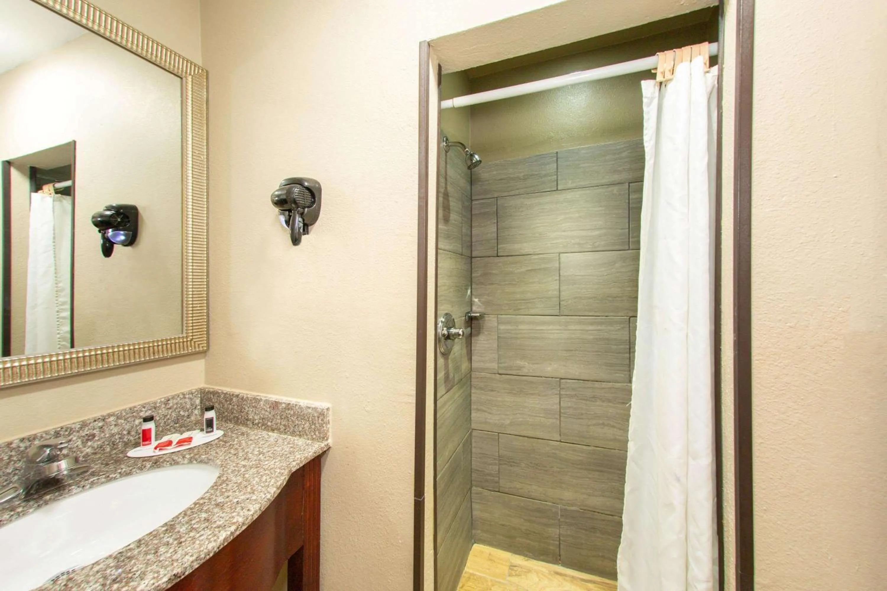 Bathroom in Super 8 by Wyndham Pensacola NAS Area