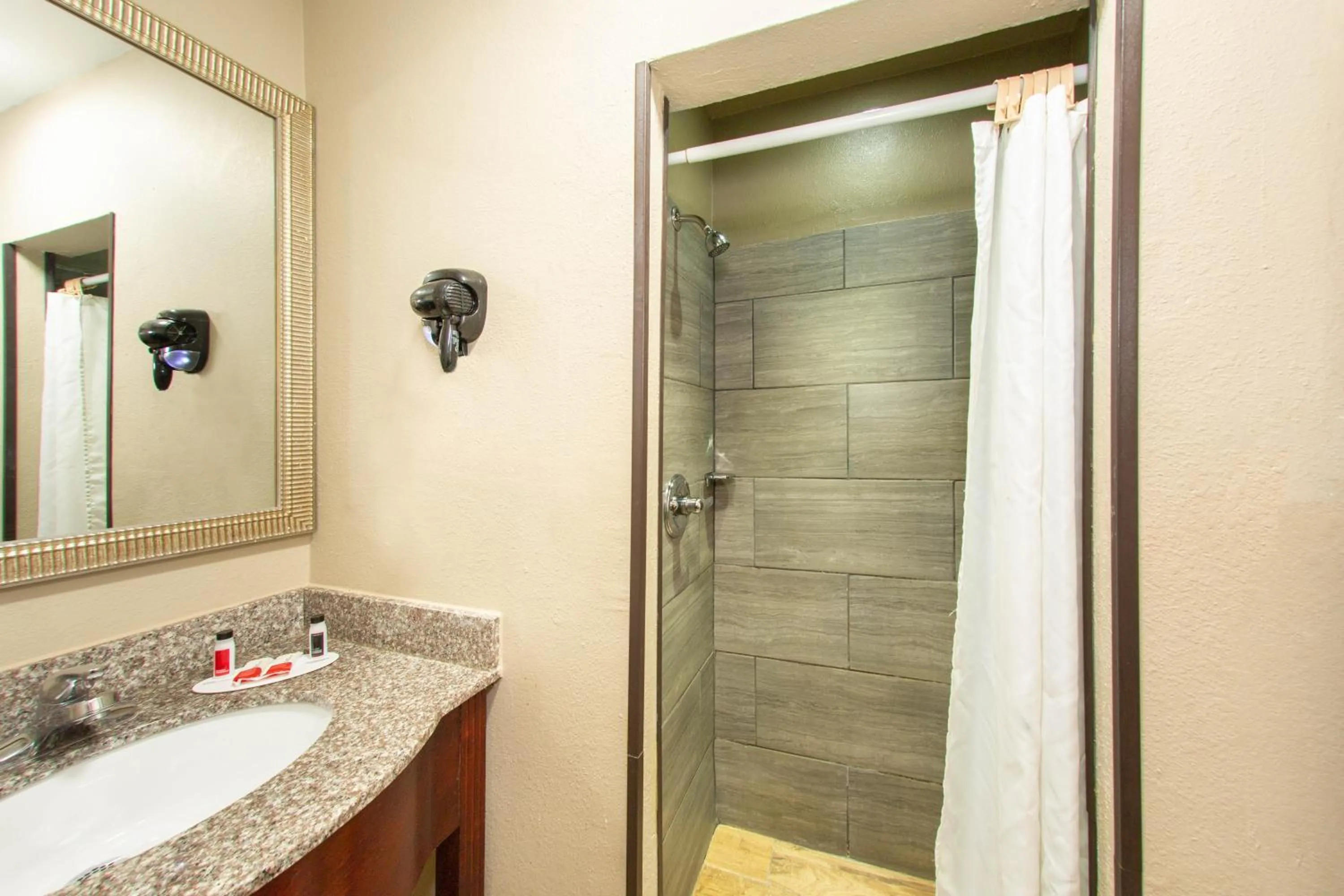 Bathroom in Super 8 by Wyndham Pensacola NAS Area