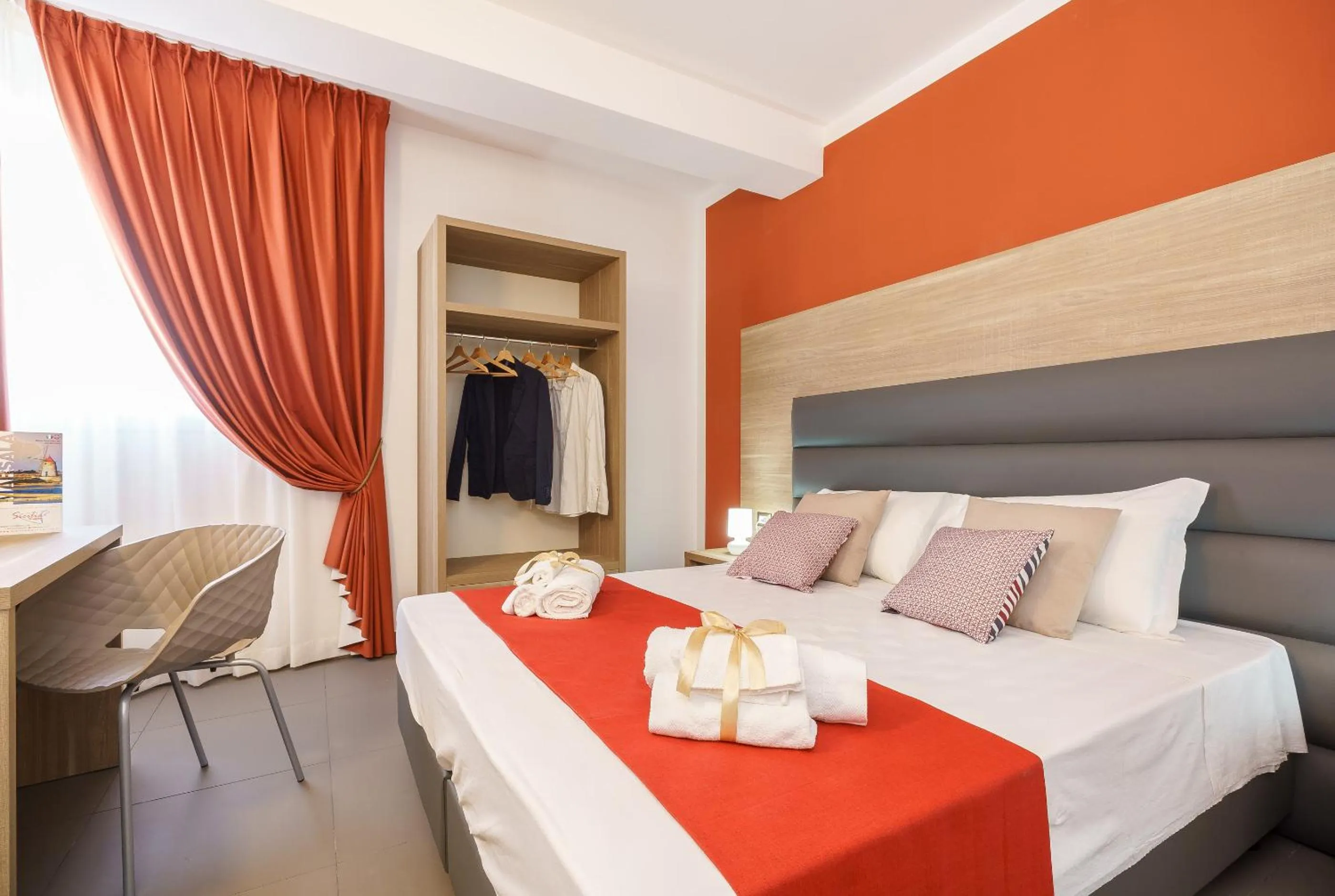 Bed in Travini Hotel Residence