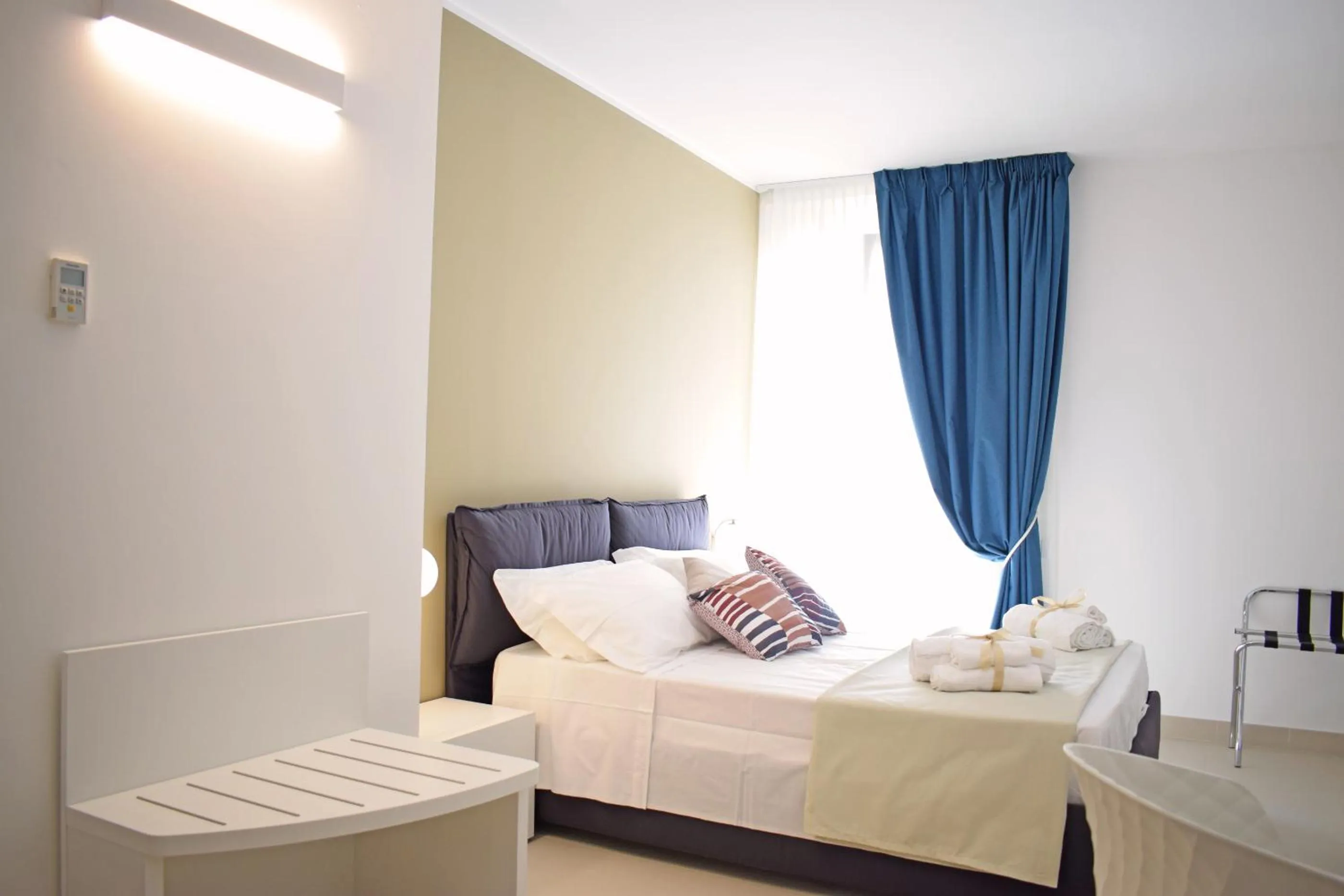 Bed in Travini Hotel Residence