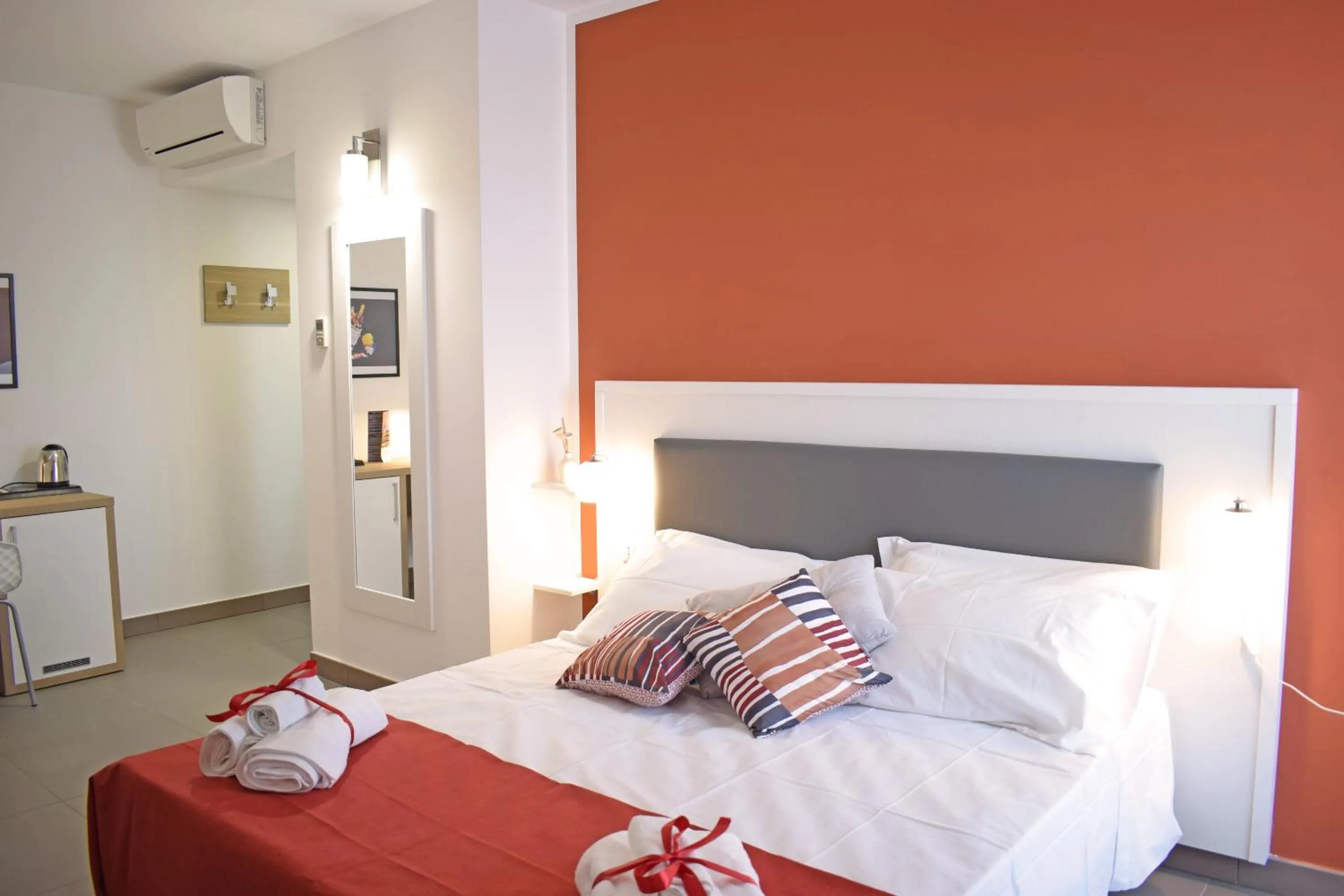 Bed in Travini Hotel Residence