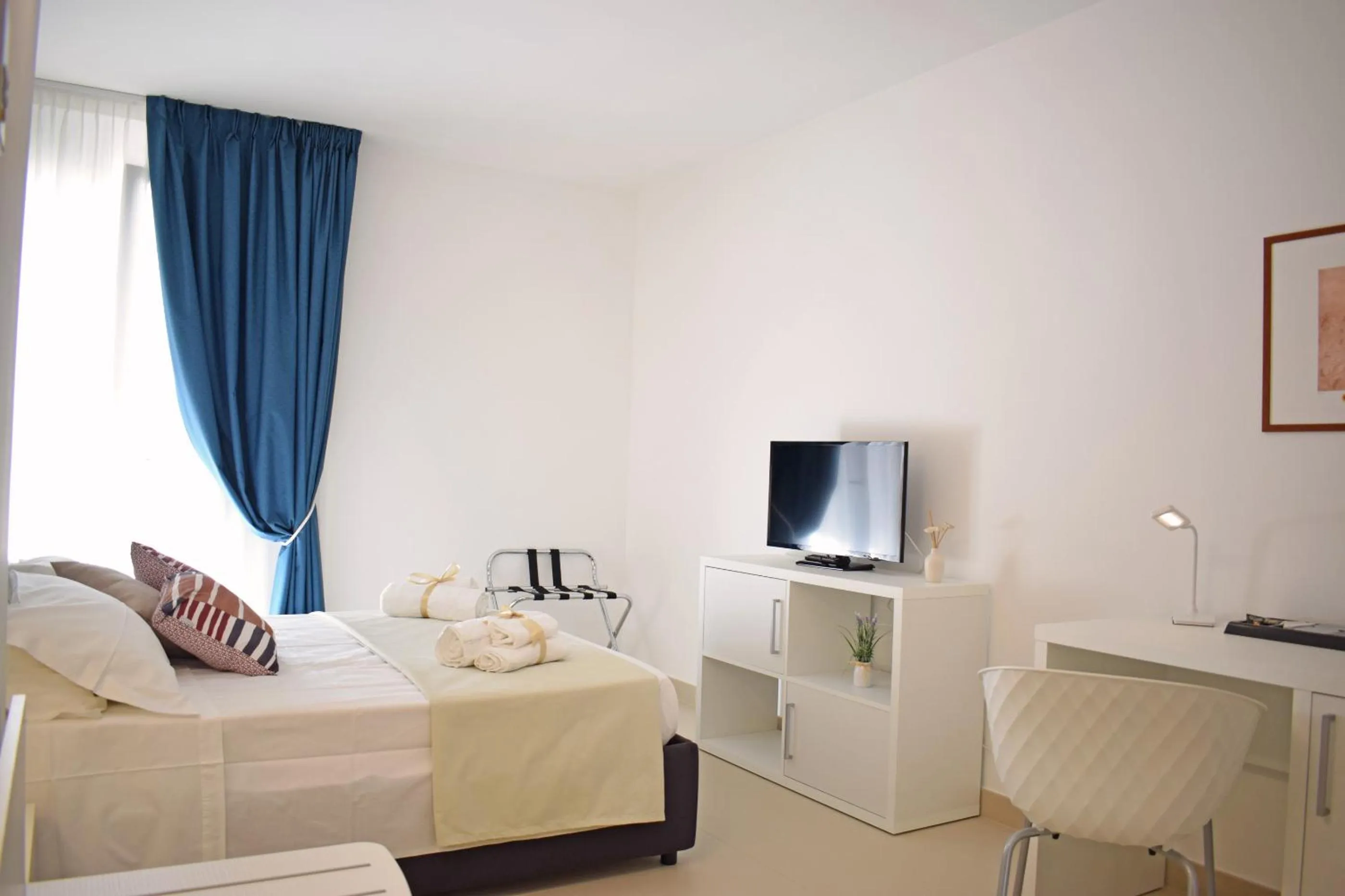 Bed in Travini Hotel Residence