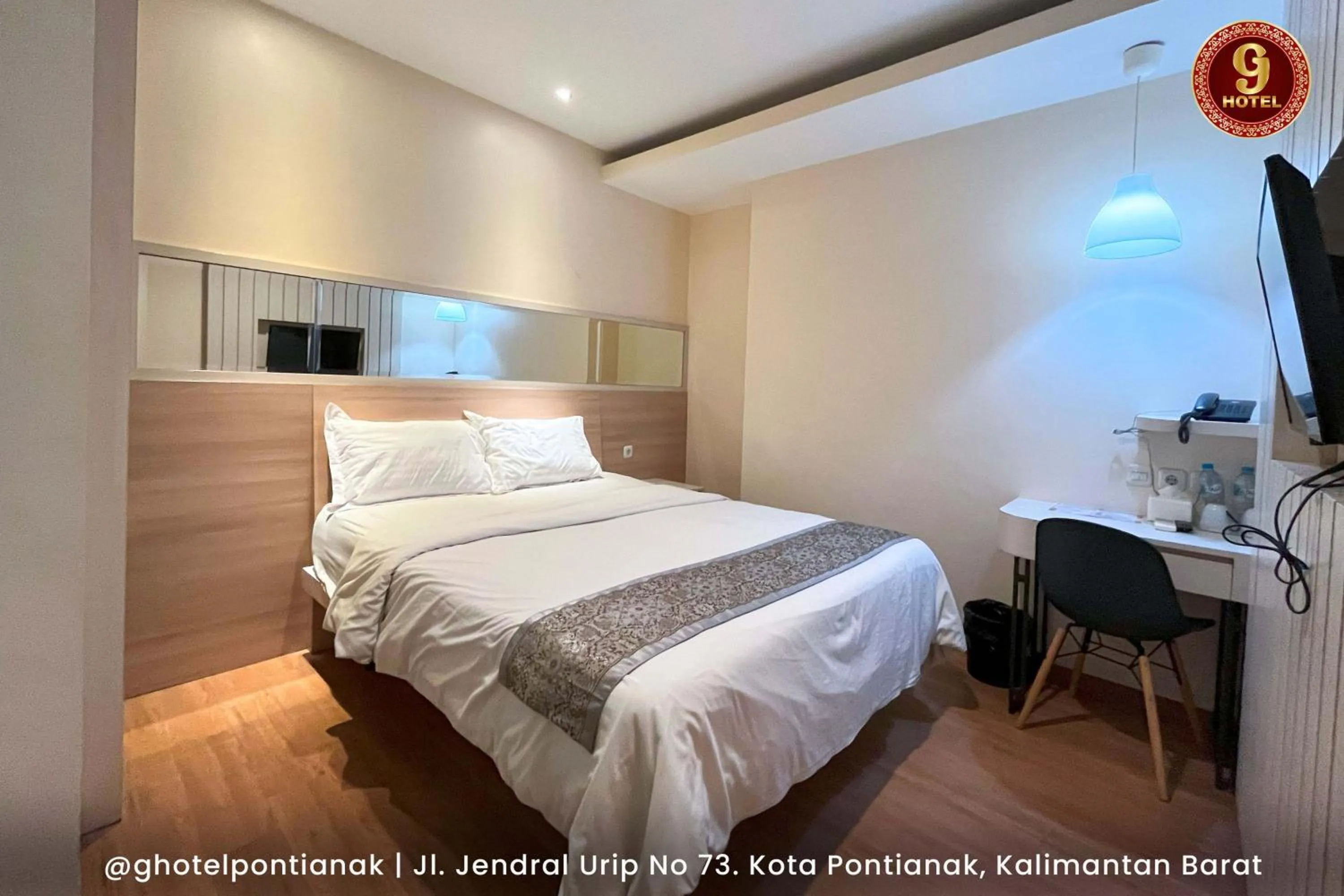 Bed in G-Hotel Pontianak