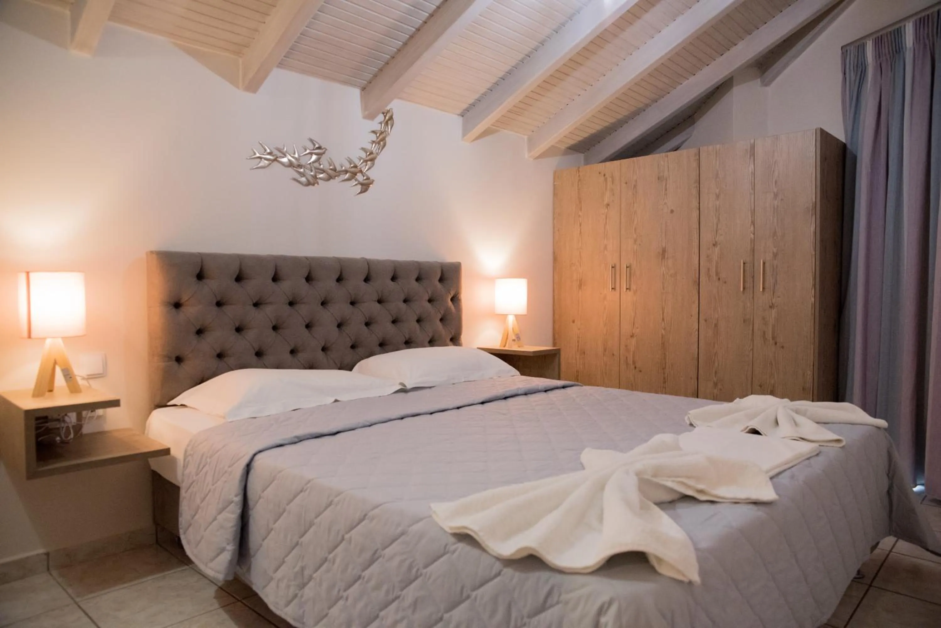 Bed in Koukos Loft Apartments