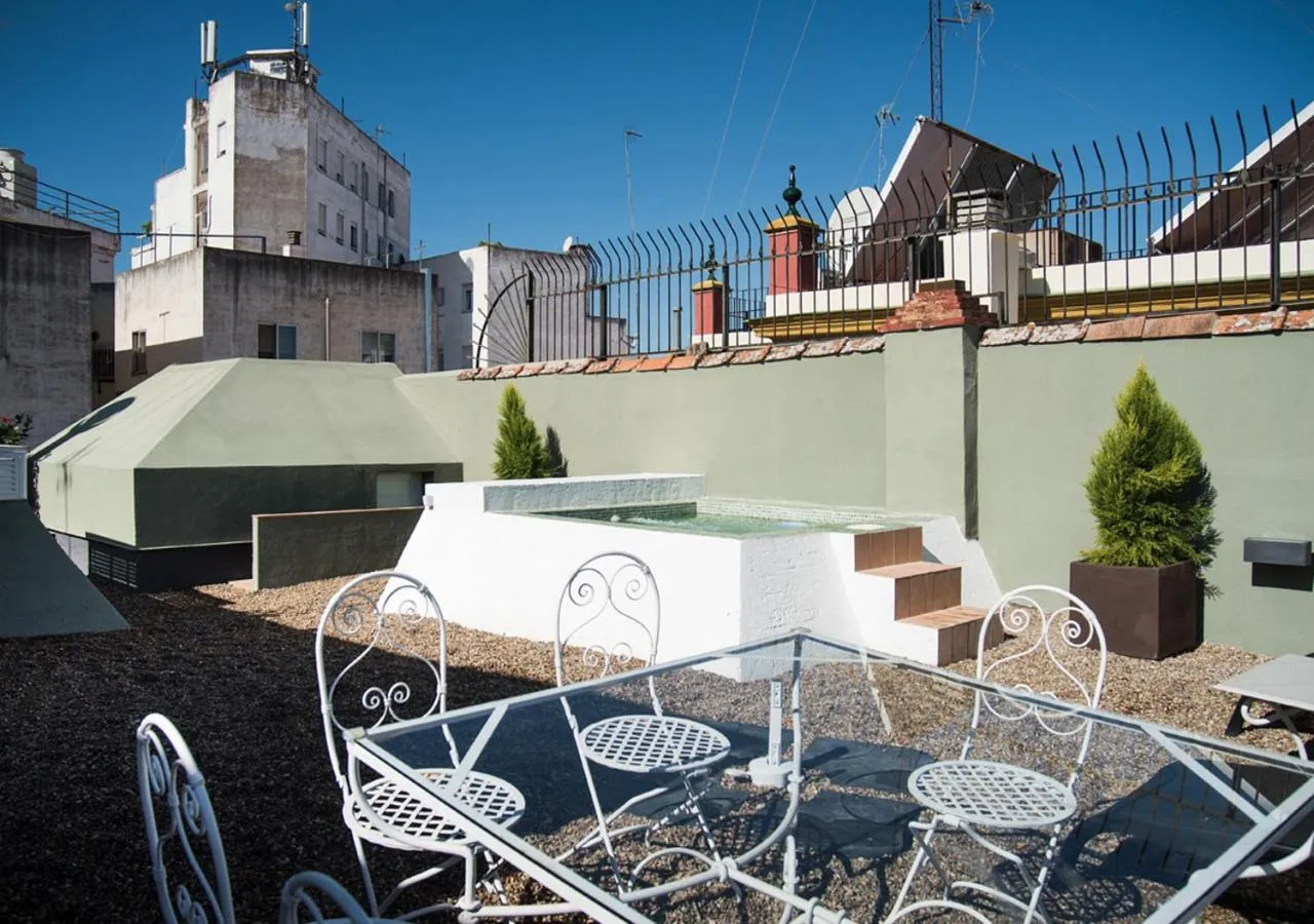 Swimming pool in Slow Suites Maestranza