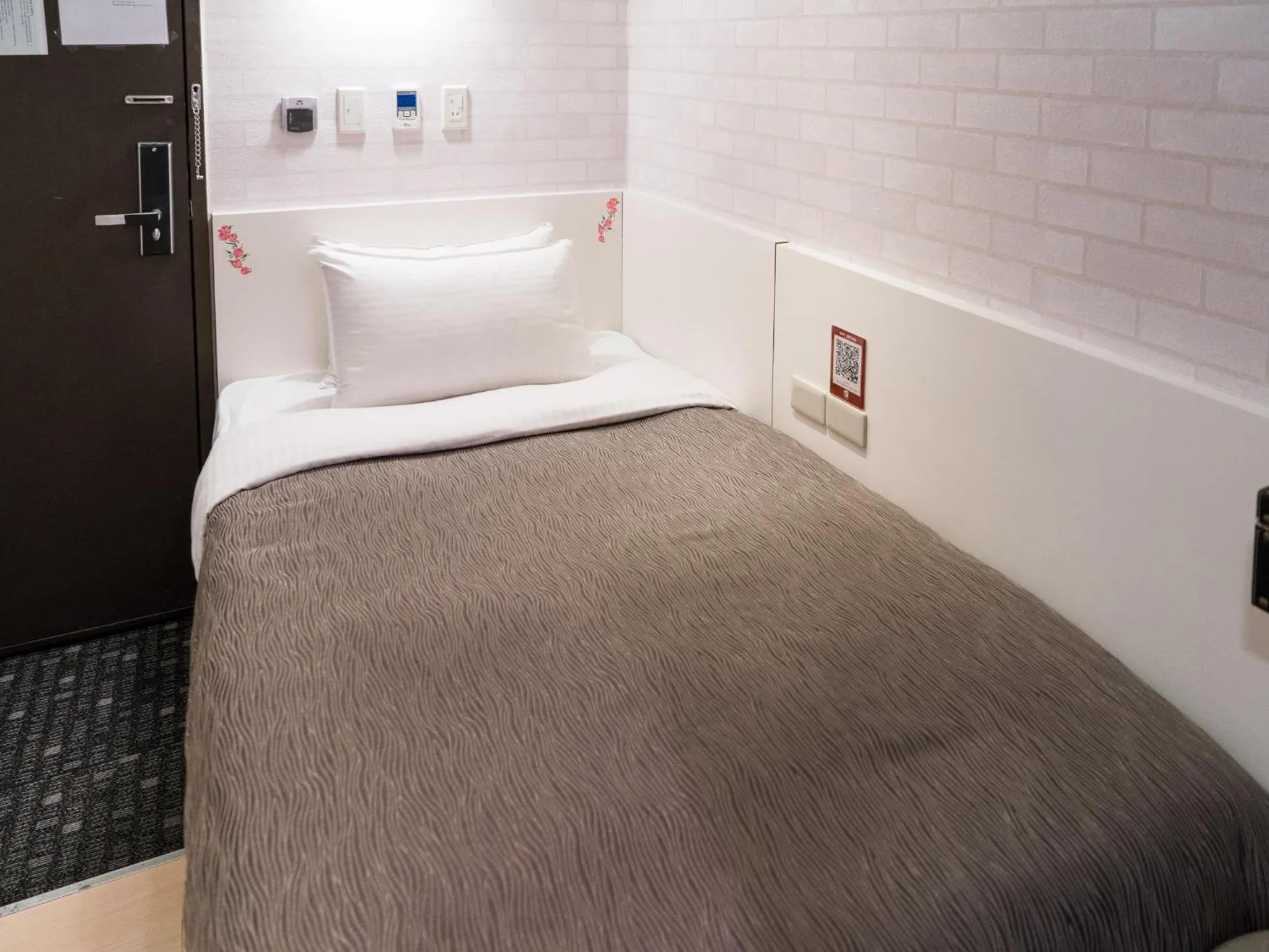 Bed in E-House Hotel