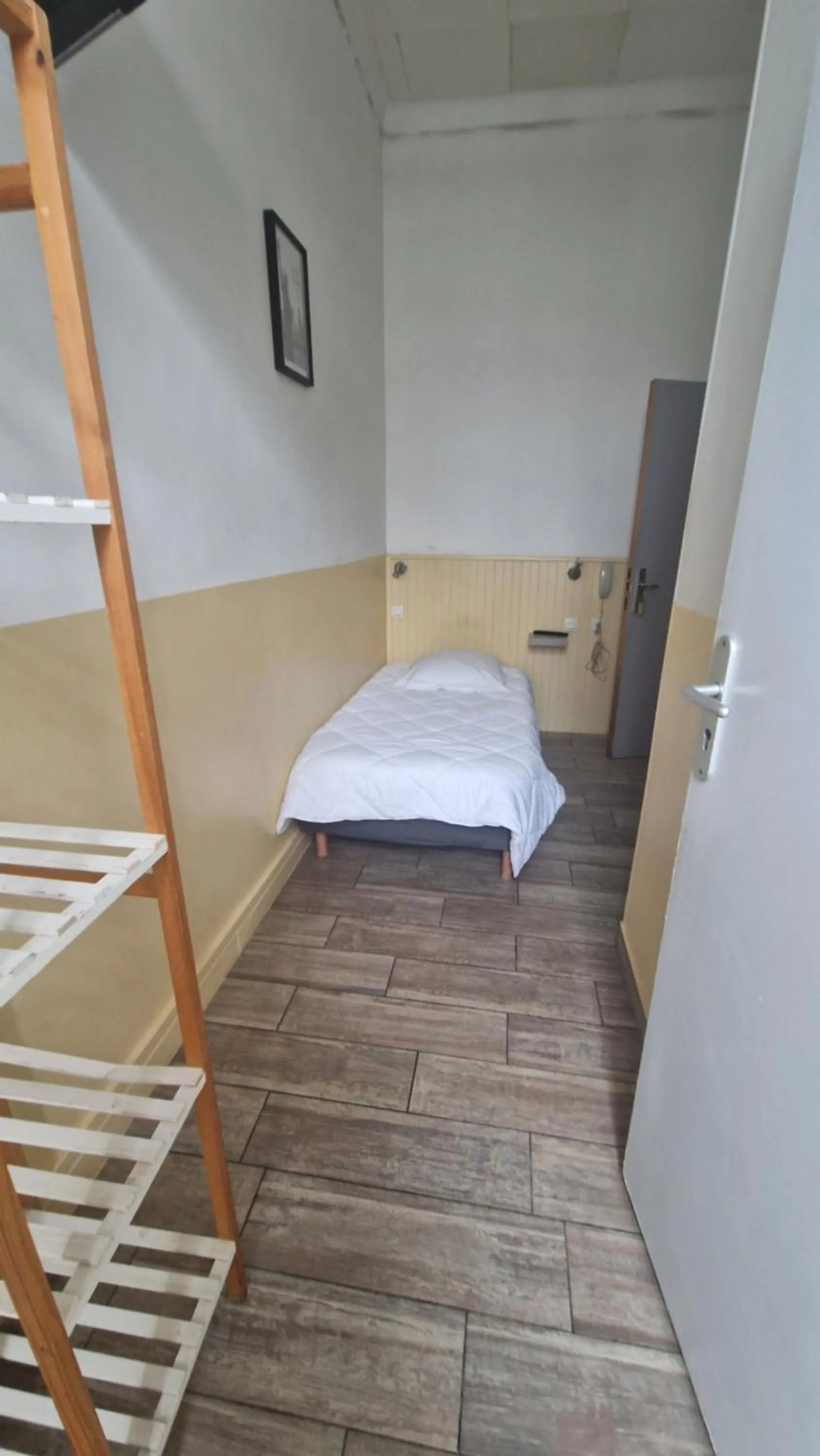 Photo of the whole room, Bed in Hôtel du Nord