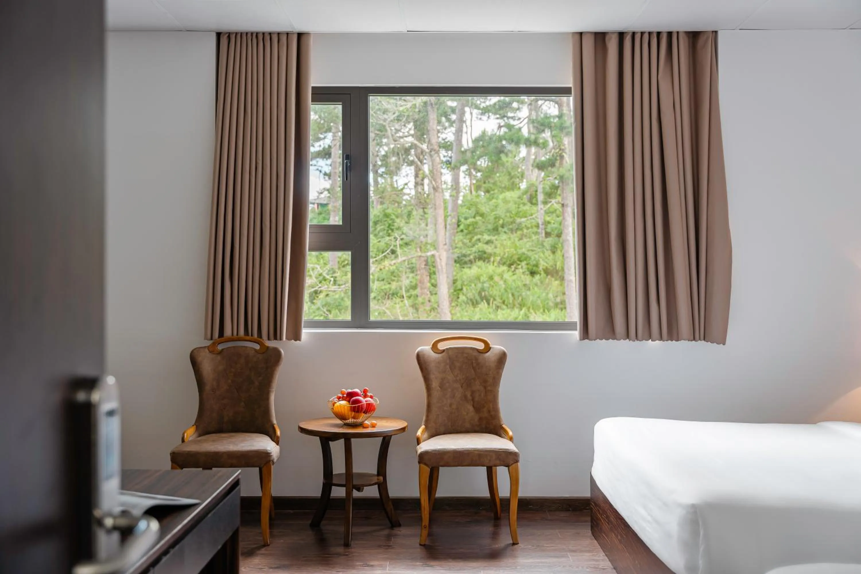 Bed in TTR Moonstone Apart Hotel