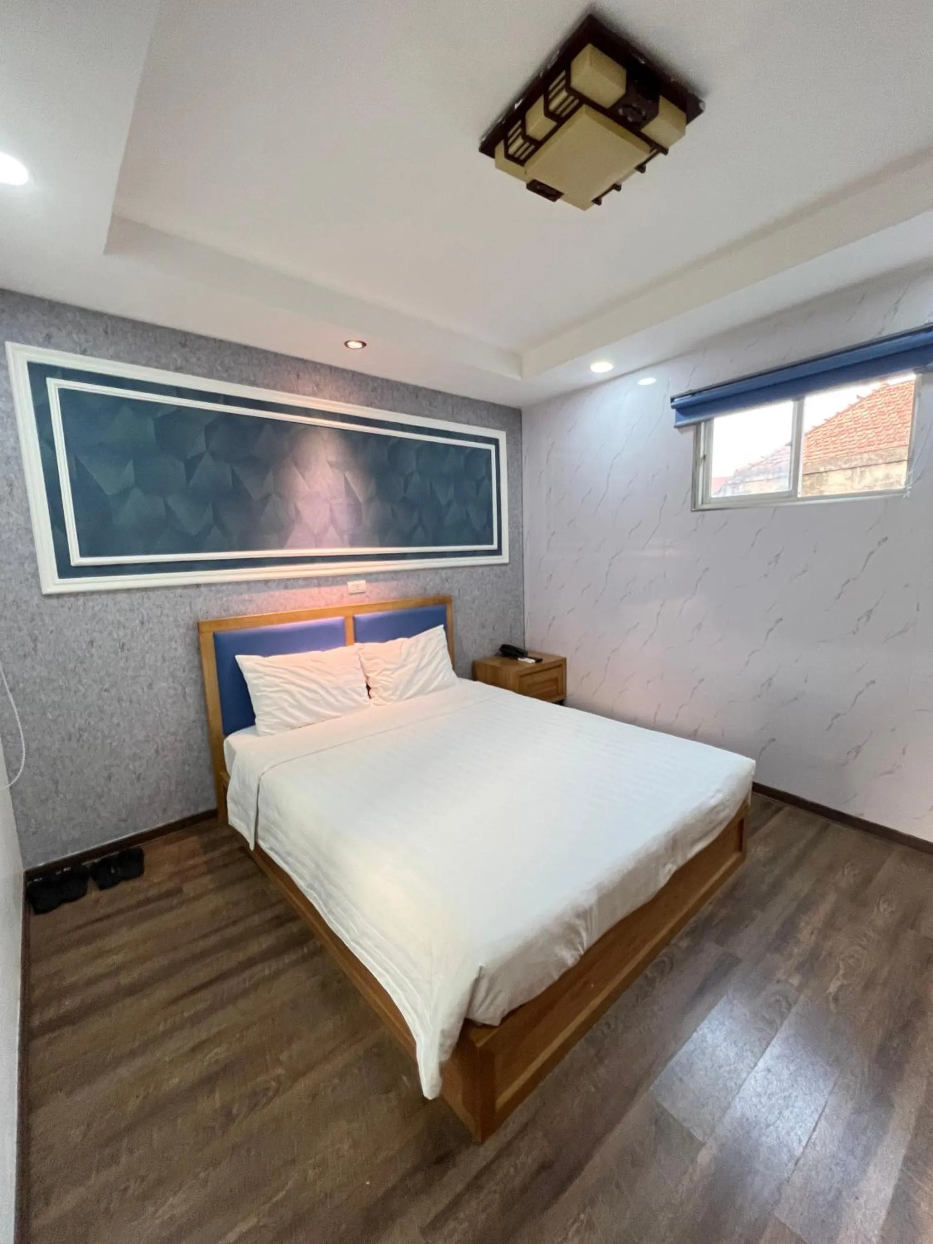 Bed in Holiday Suites Hotel & Spa