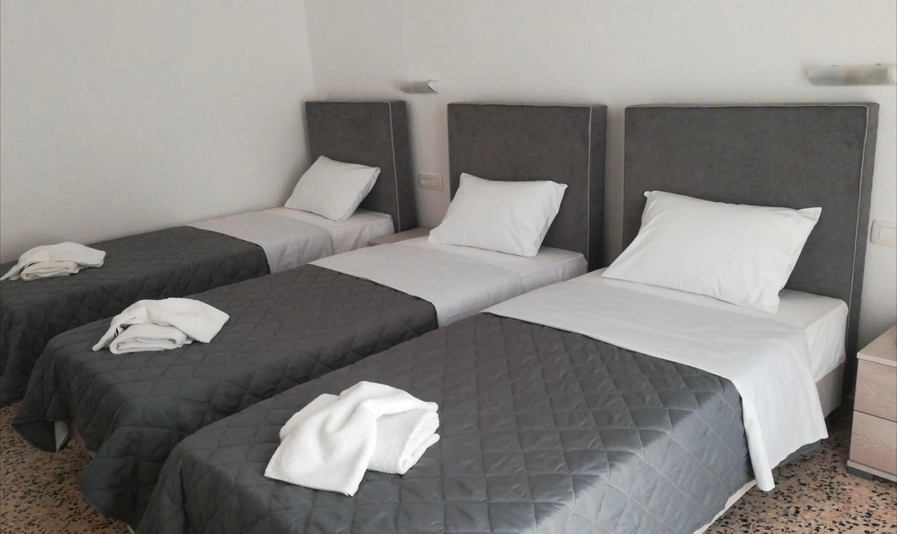 Bed in Nikos Hotel