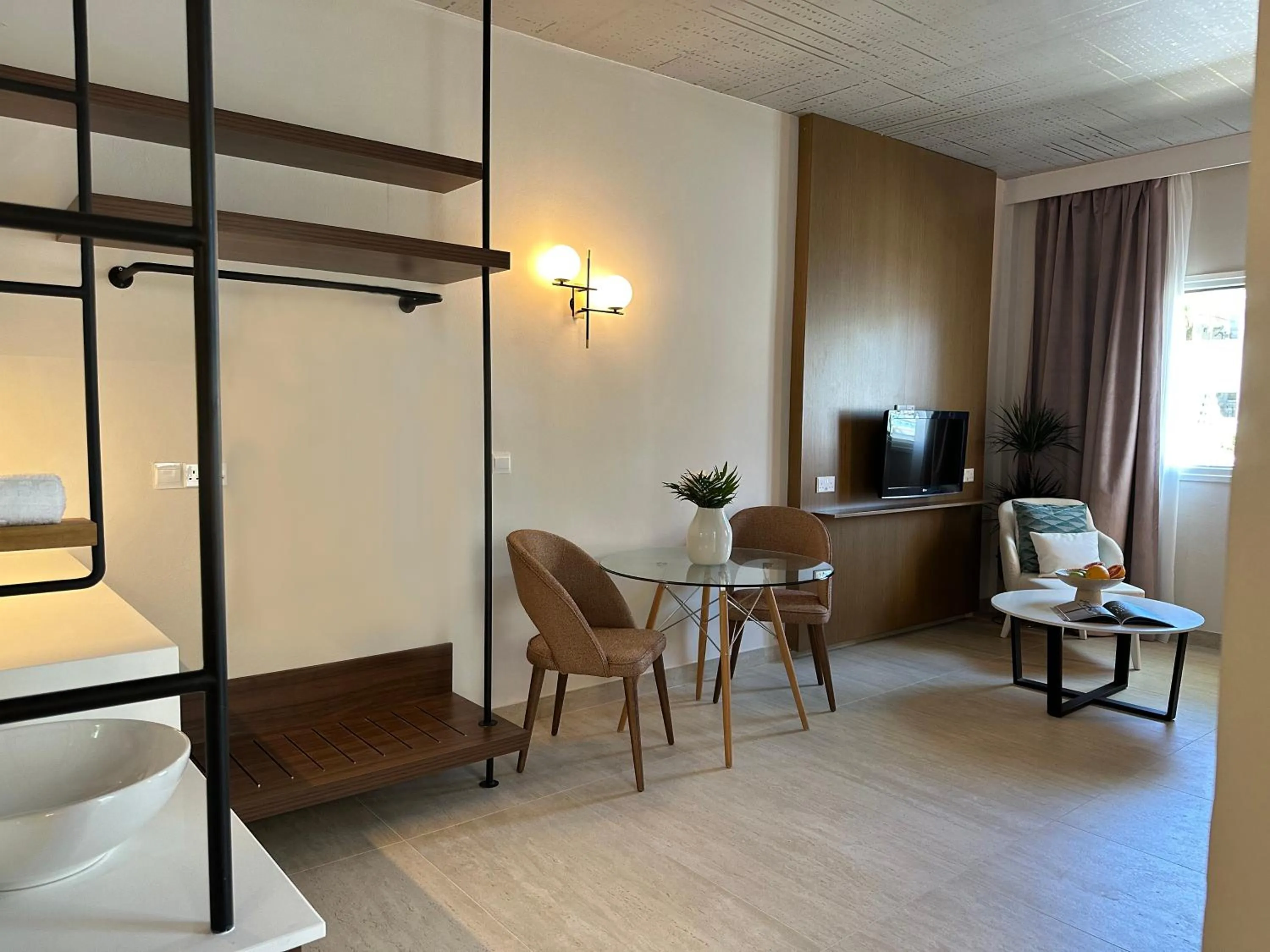 Seating area, Bed in King Jason Paphos - Designed for Adults by Louis Hotels