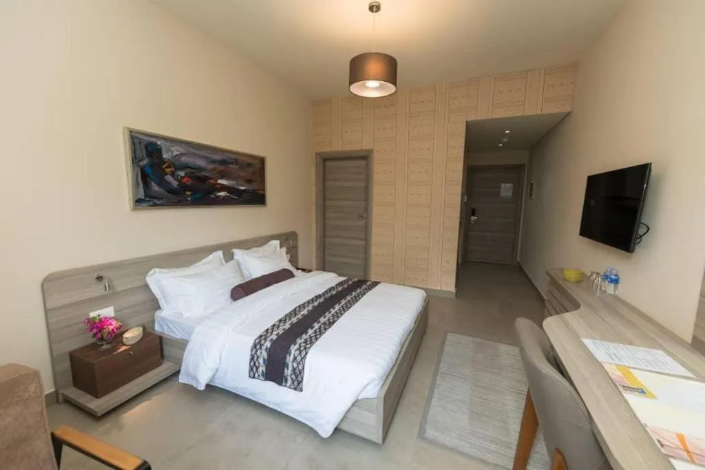 Bed in Roots Hotel Apartments Abidjan