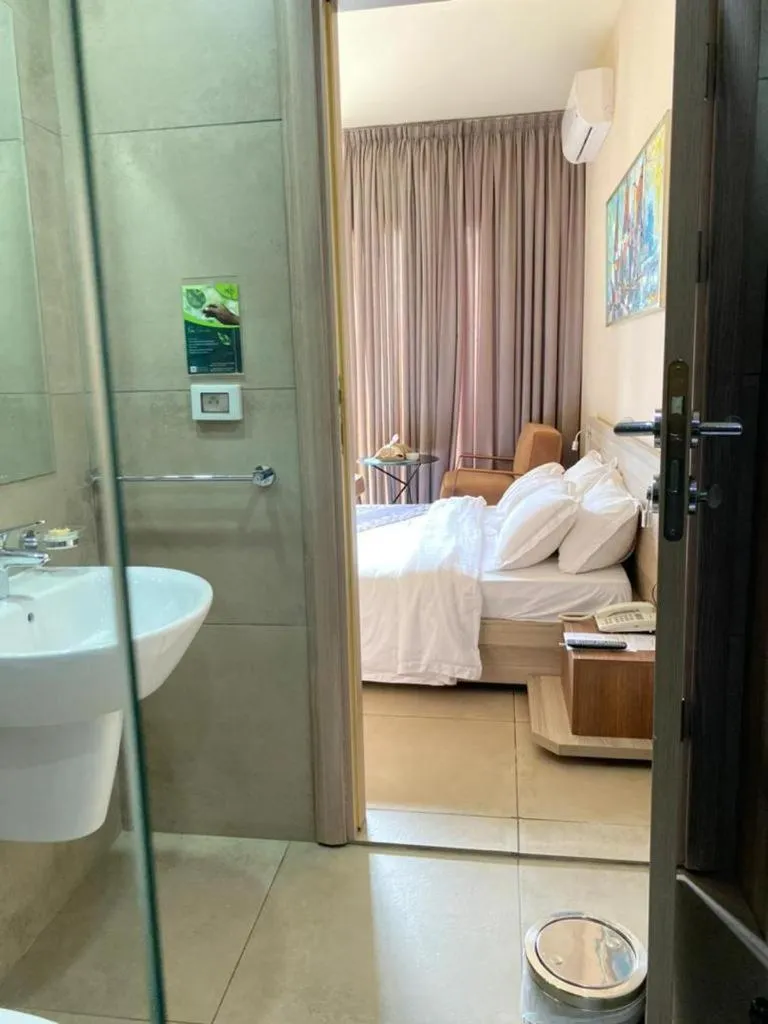 Bed in Roots Hotel Apartments Abidjan