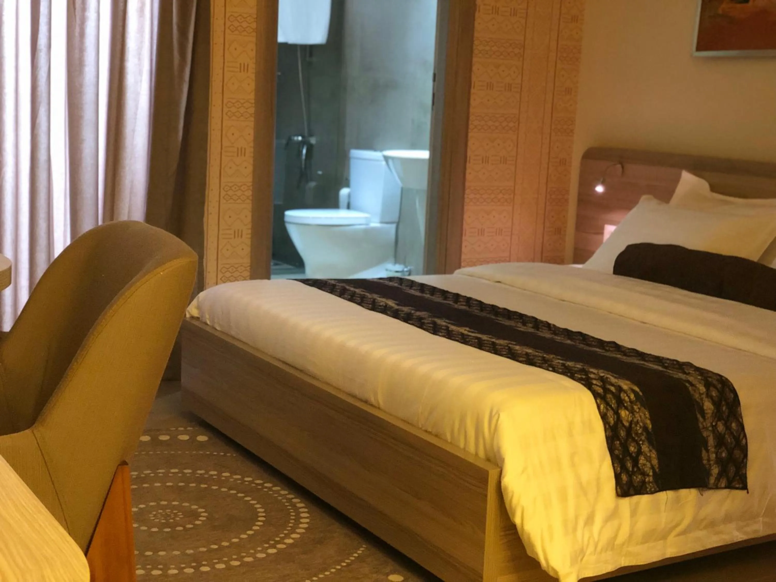 Bed in Roots Hotel Apartments Abidjan