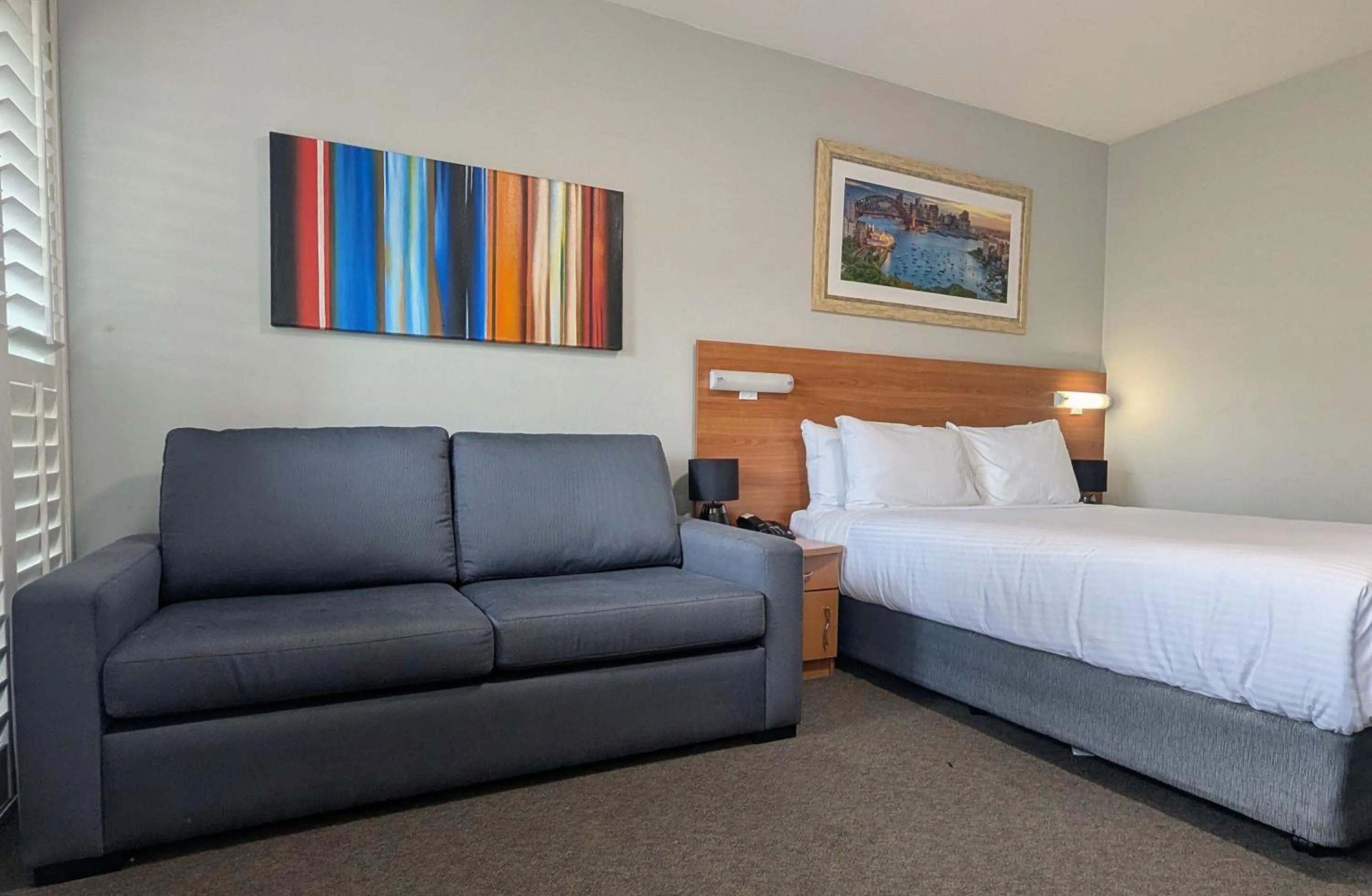 Bed in Ramada Hotel & Suites by Wyndham Cabramatta