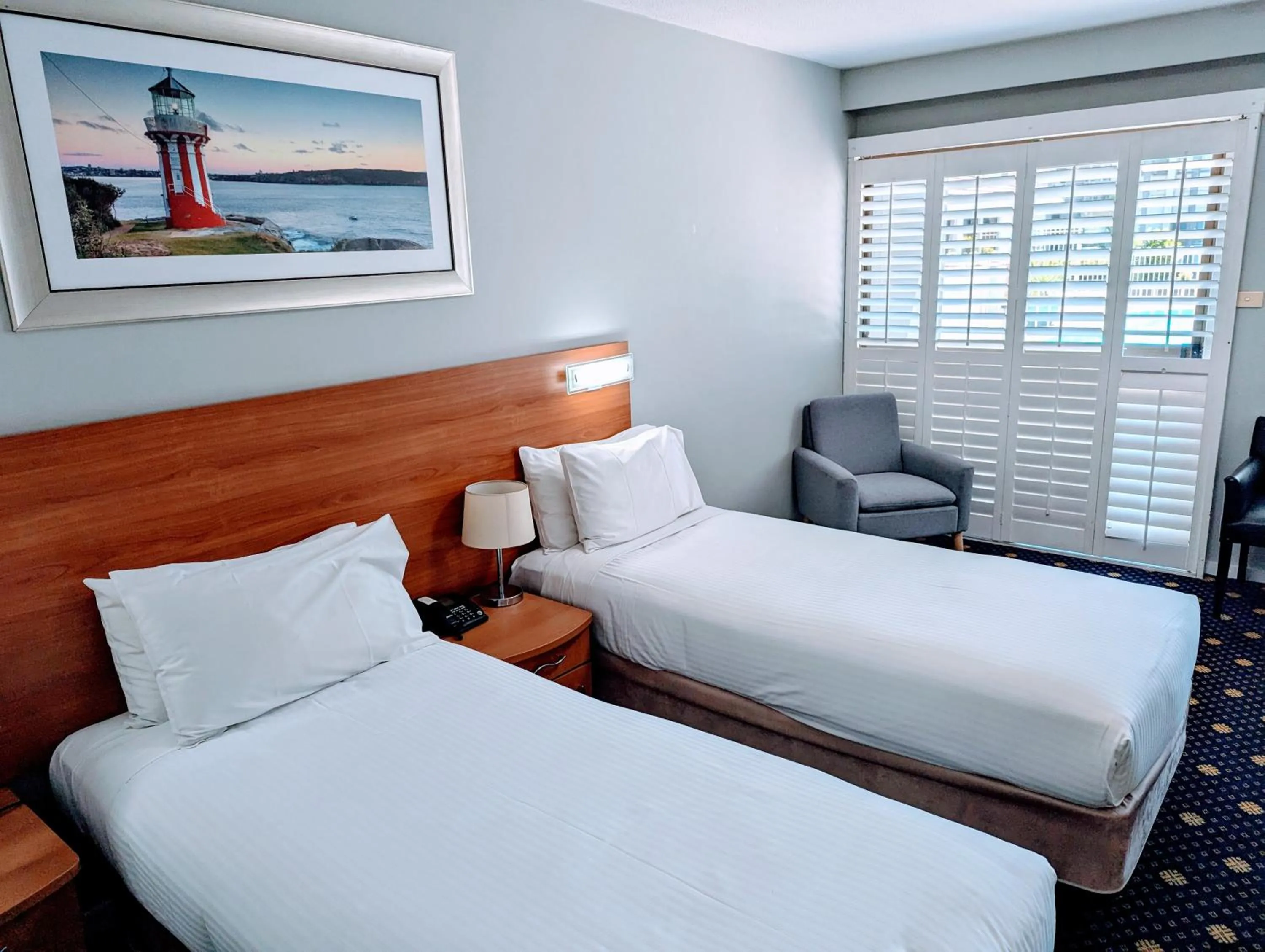 Bed in Ramada Hotel & Suites by Wyndham Cabramatta