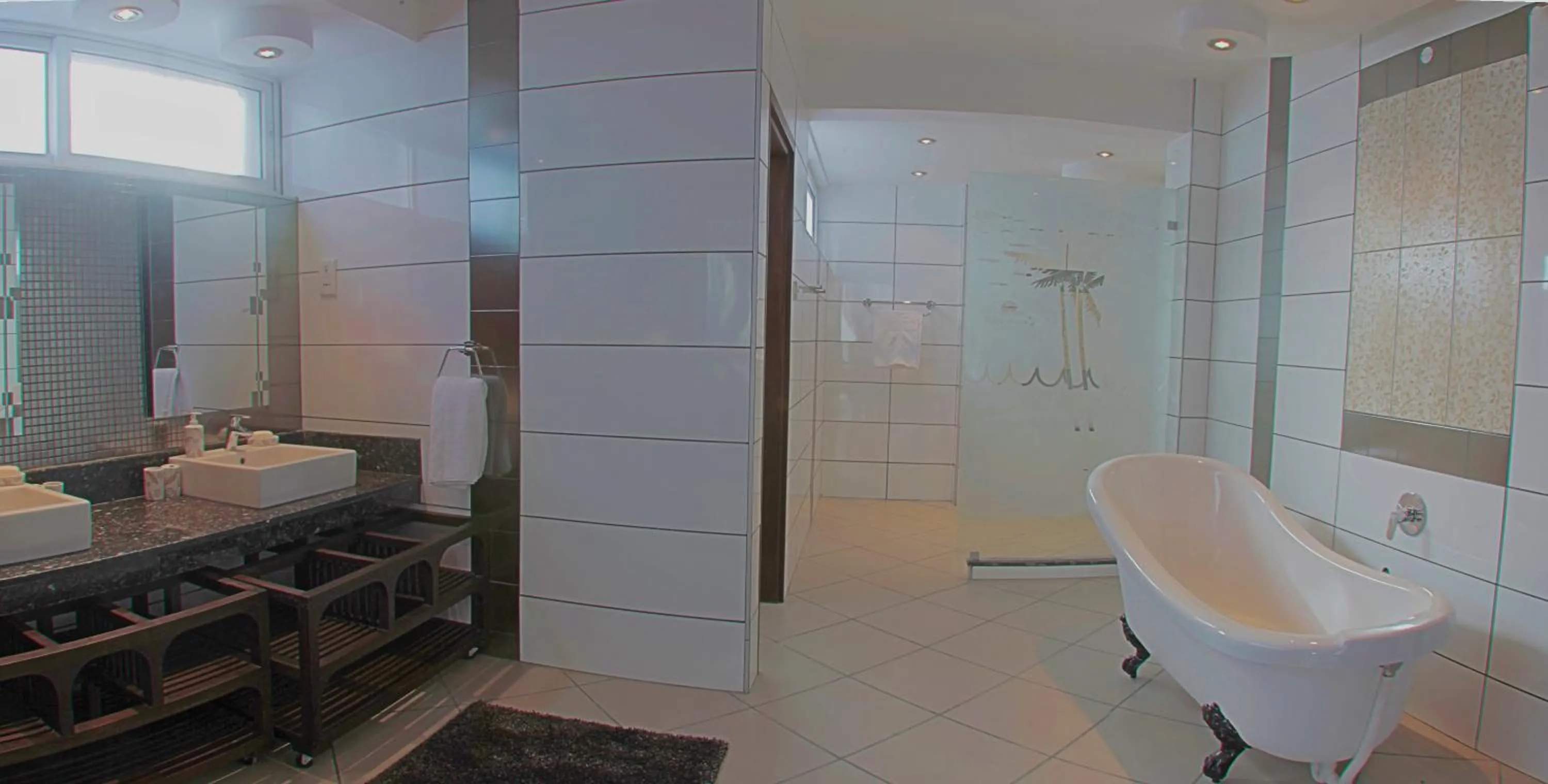 Bathroom in Cowrie Shell Beach Apartments Official
