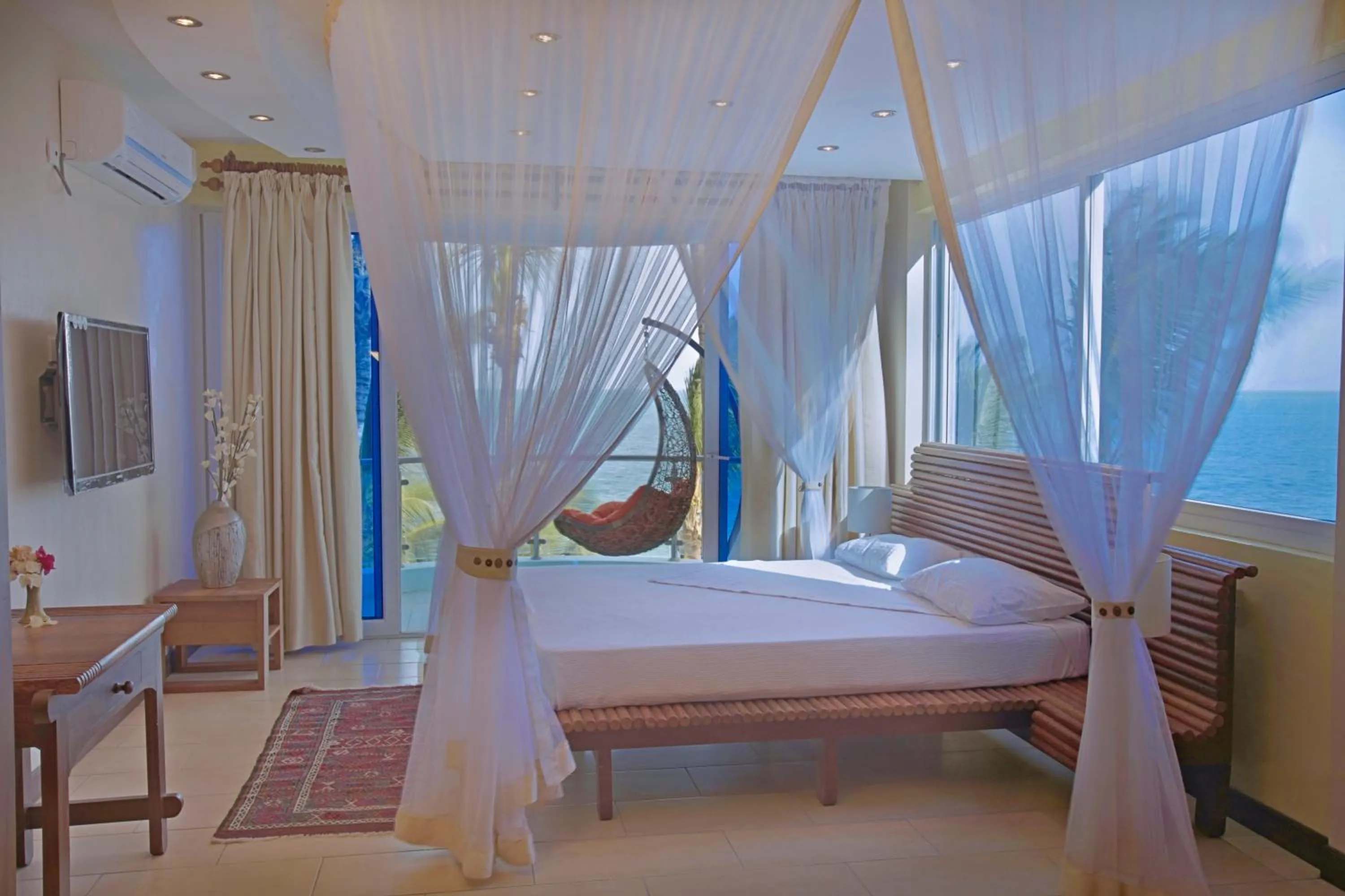 Bedroom, Bed in Cowrie Shell Beach Apartments Official