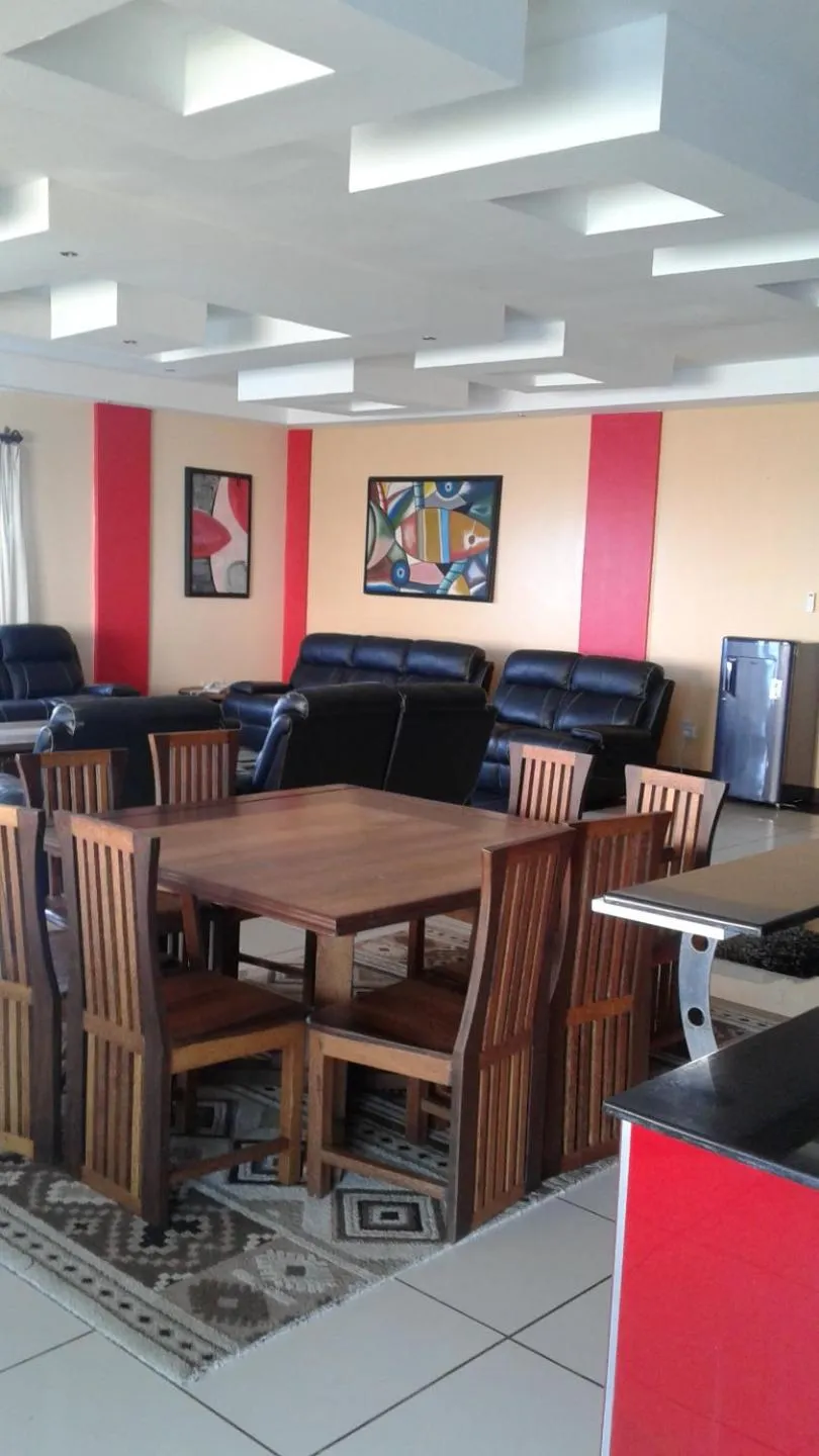 Dining area in Cowrie Shell Beach Apartments Official